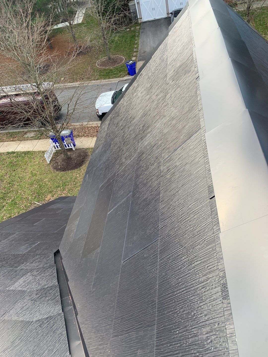 Tesla Solar Roof and Gutter Installation by American Home Contractors