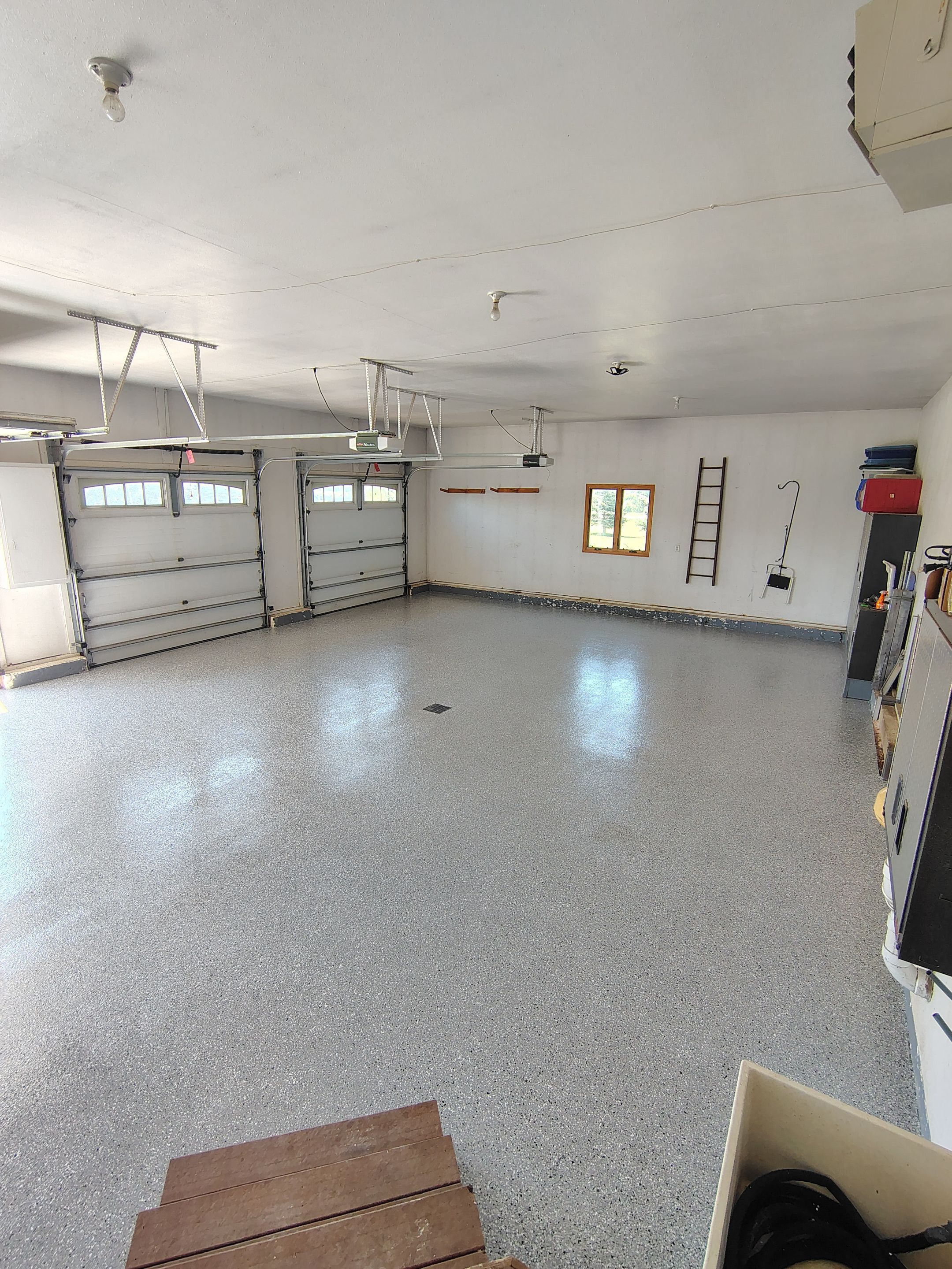 Feather Grey Garage Floor Coating Installation in Valley Springs by Select Painting, Coatings & Garage Cabinets