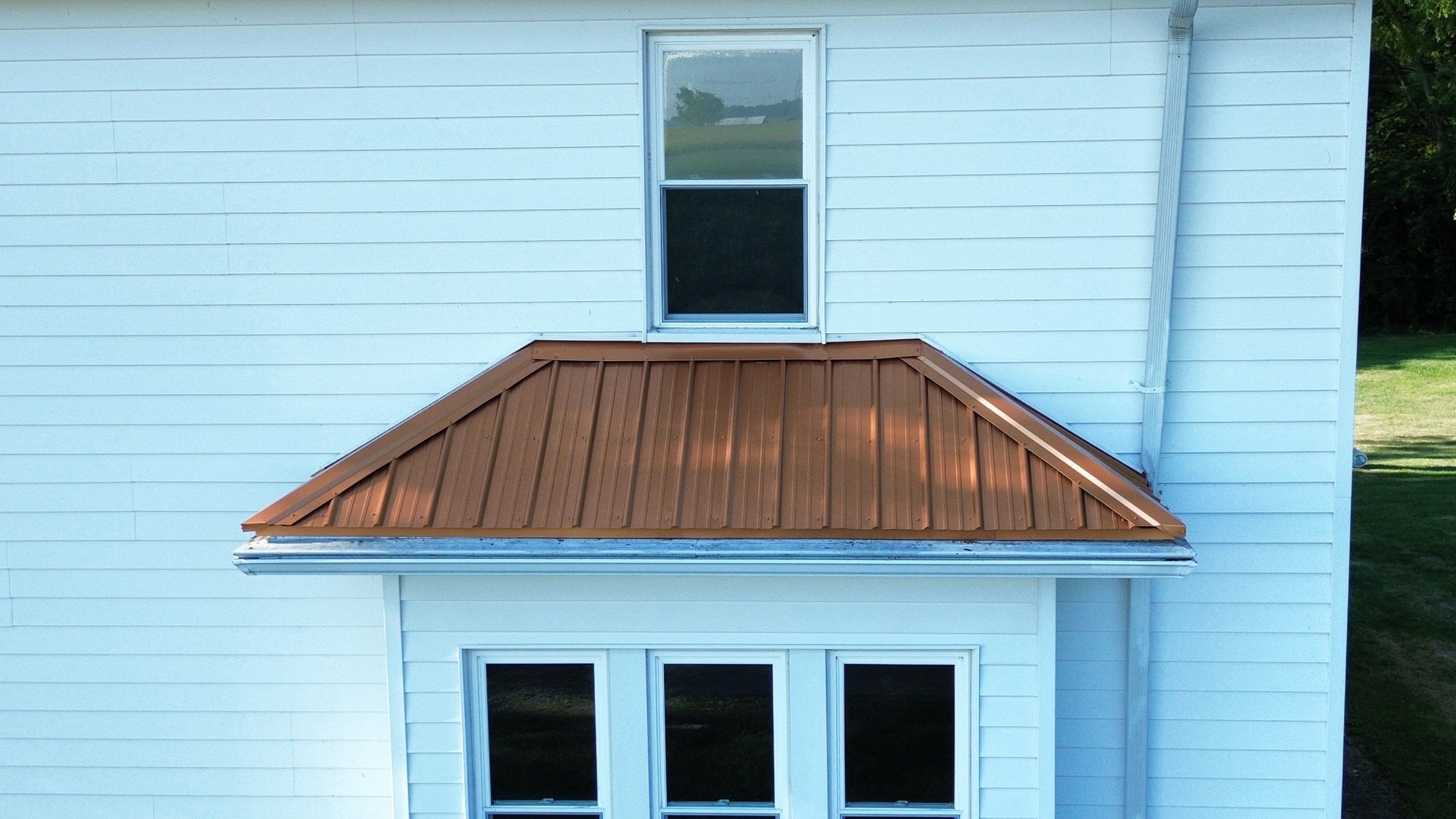Residential Roofing Installation using Performance Panel Metal - Copper Metallic by RoofX 