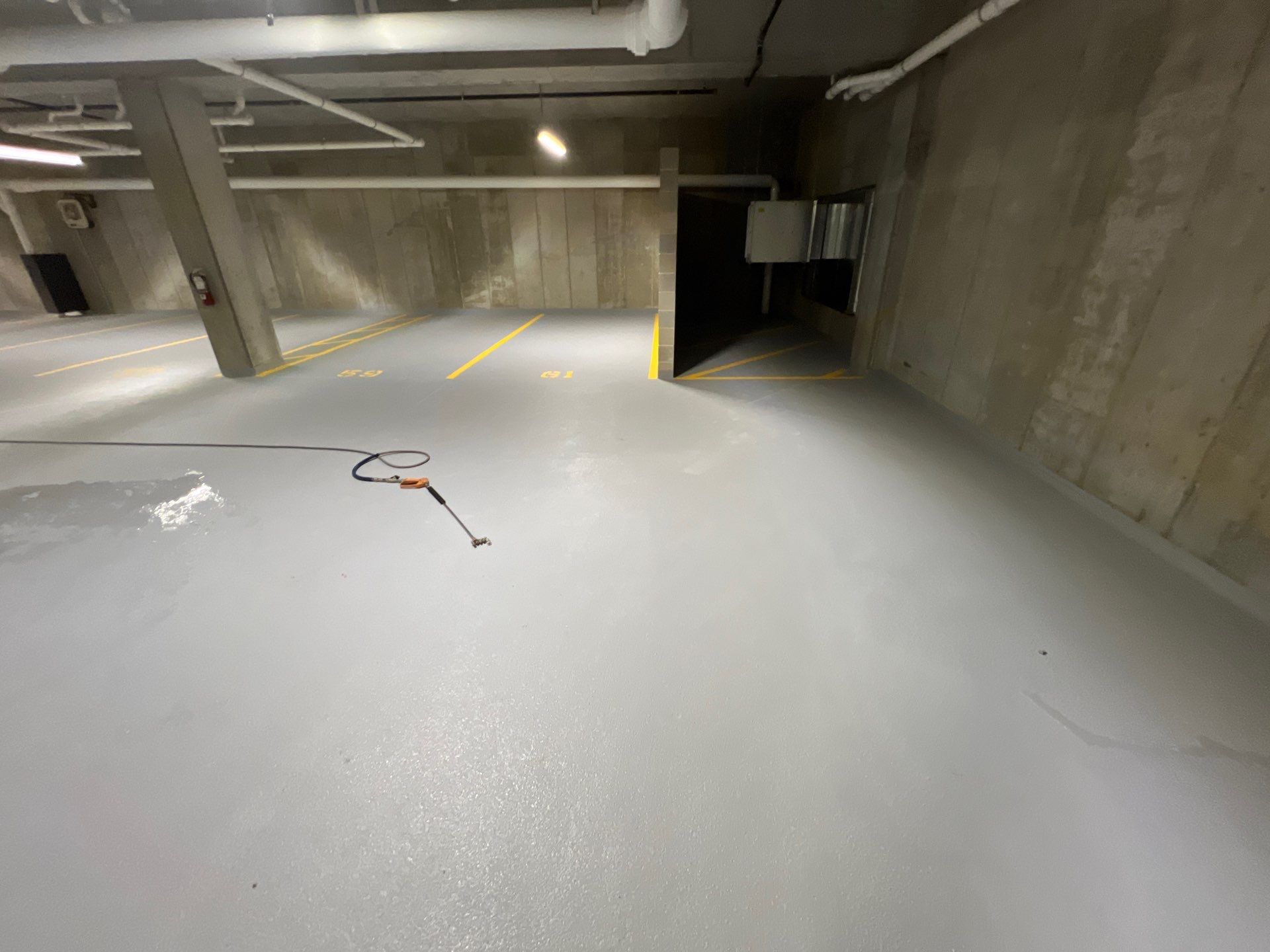 Parking garage using Hot water by Northern Power Washing LLC.