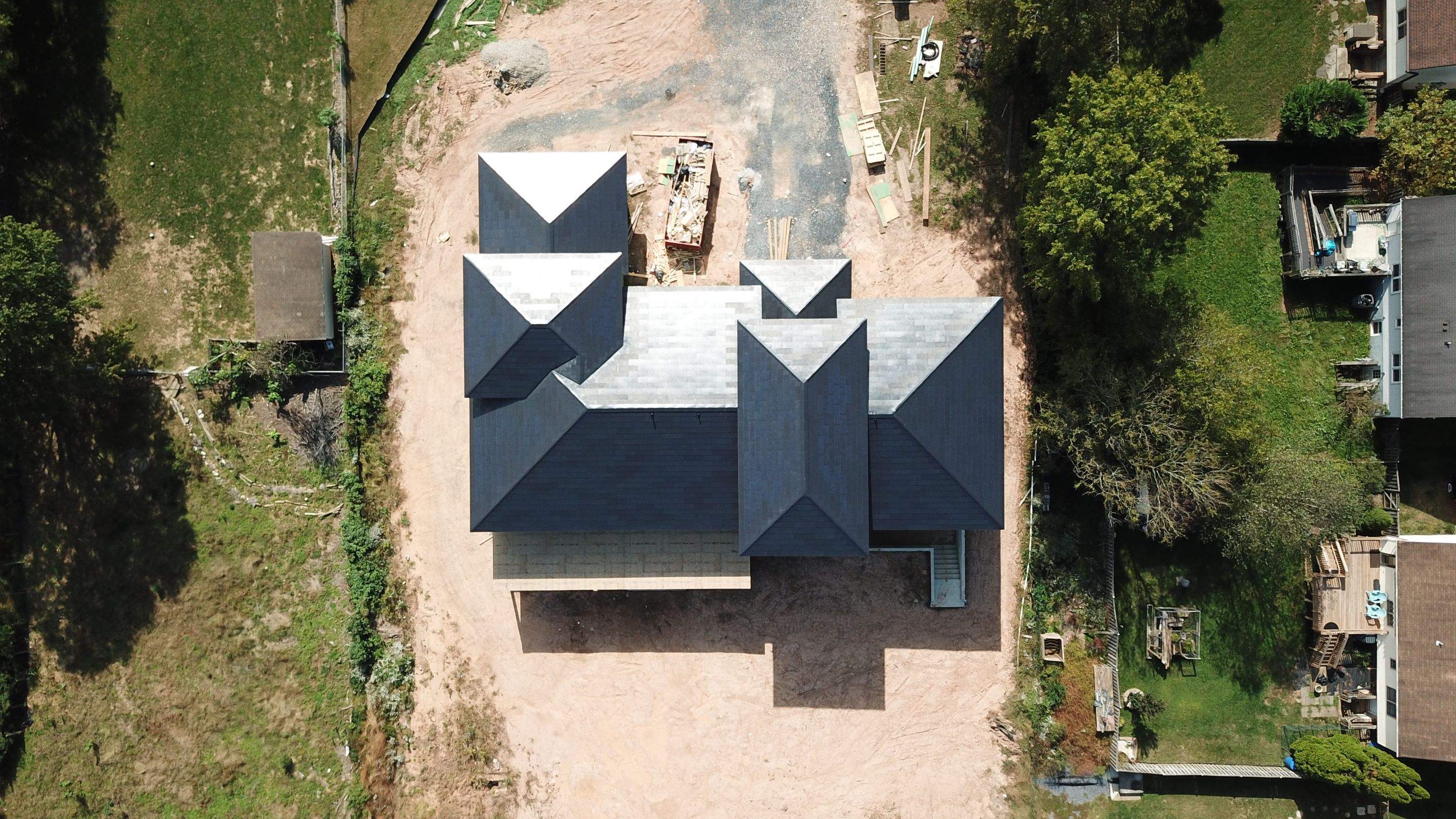Tesla Solar Roof  using Tesla Solar Roof V3 tiles by American Home Contractors