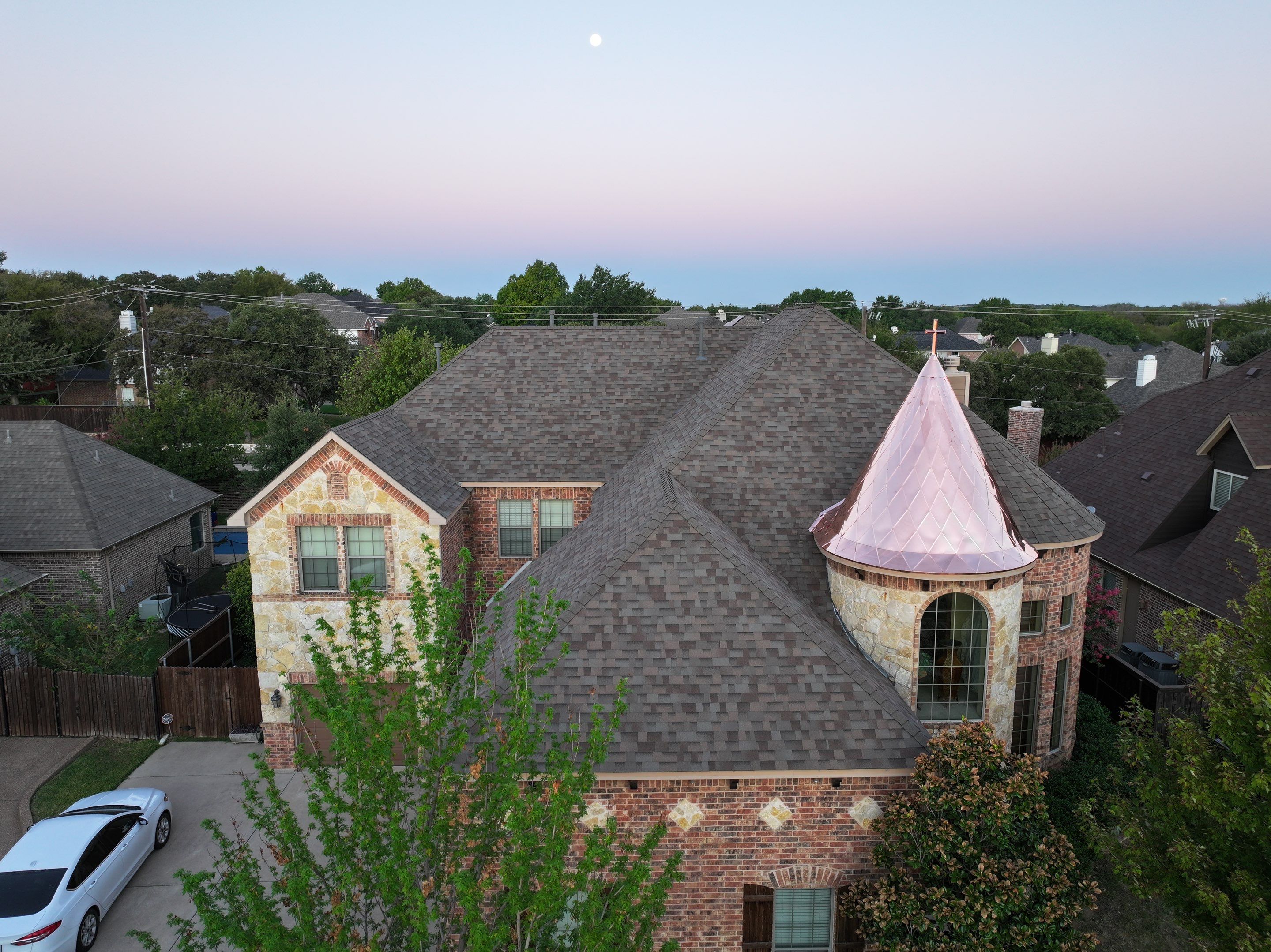 Installing Custom copper turret and Malarkey Vista Class 4 shingles Hail Damage Upgrade by Becker Roofing and Exteriors