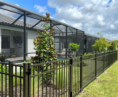 Aluminum Fence Installation using Bronze 3 Rail Aluminum Fence