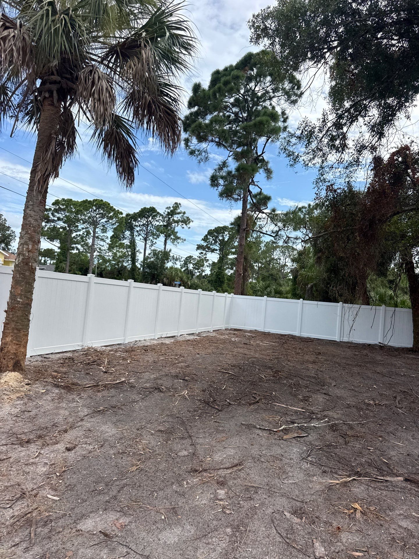 White Vinyl Privacy Fence Installation in North Port Florida by True Fence LLC