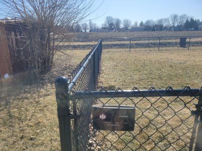 Residential Black Chain Link Fence and Gate Installation in Tripoli