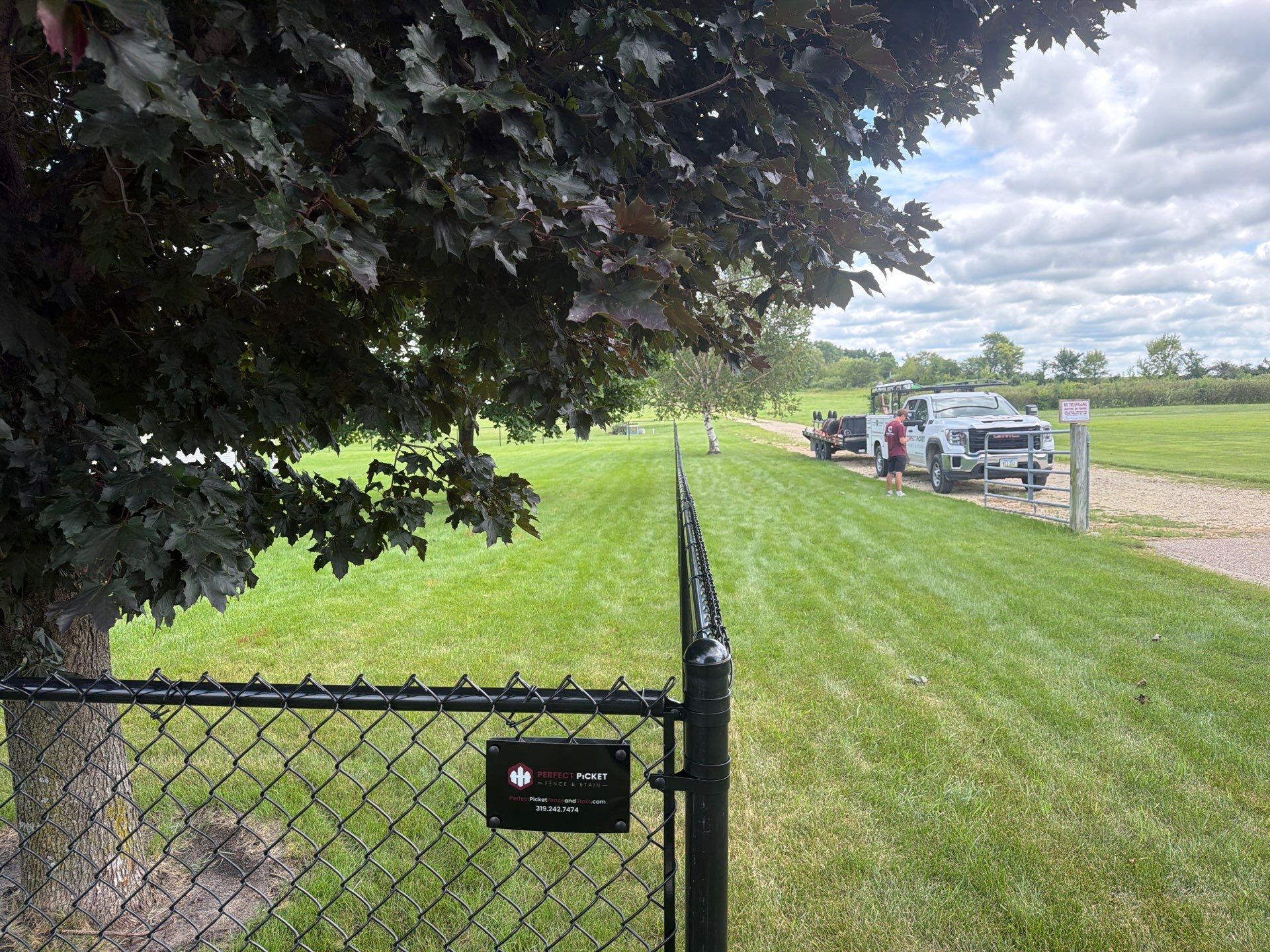 Black Vinyl-Coated Chain Link Fence Installation in Fairbank by Perfect Picket Fence and Stain
