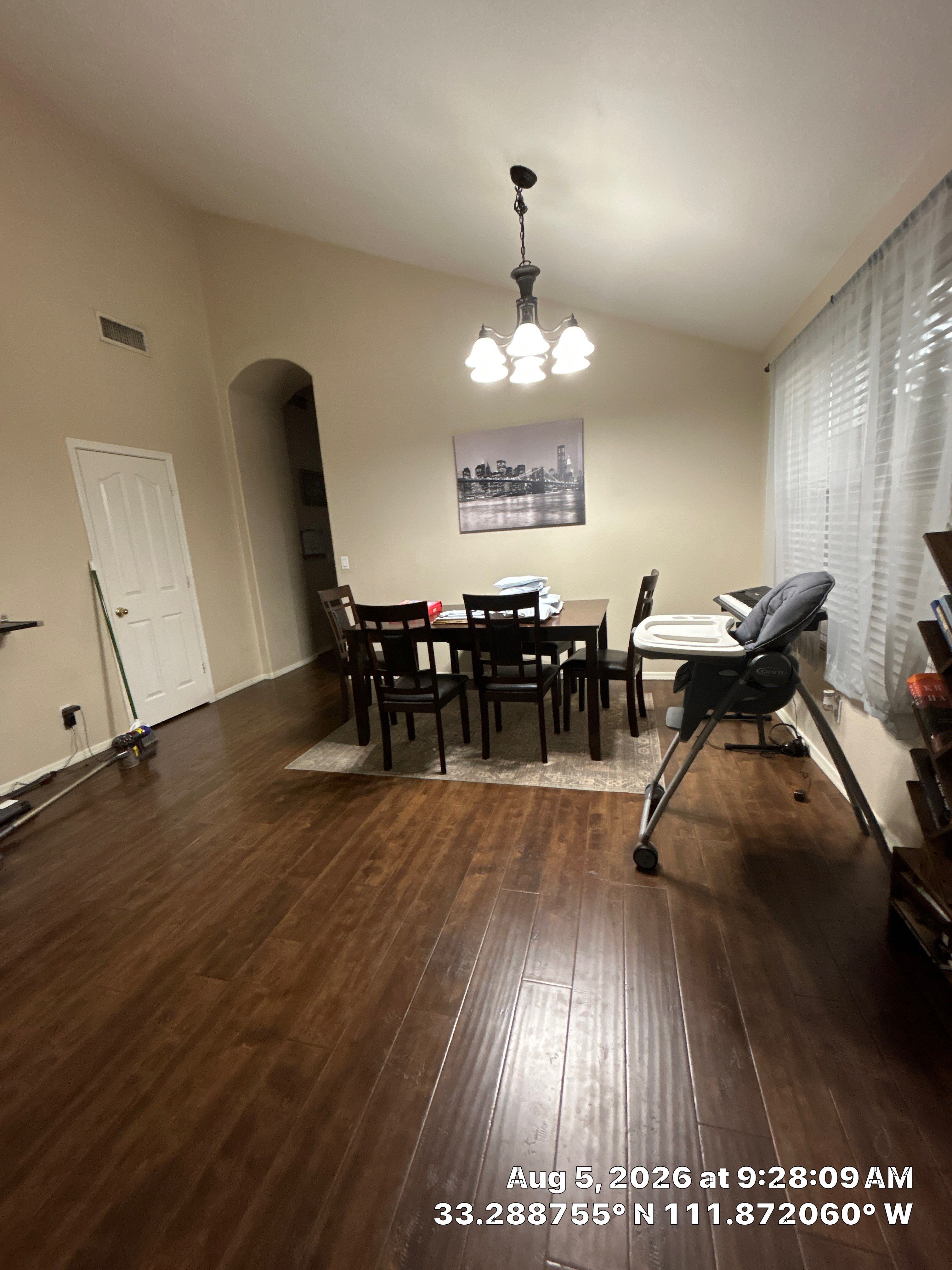Modern Dining Room Renovation With Dark Wood Flooring in Chandler by CompanyCam Sales Demo