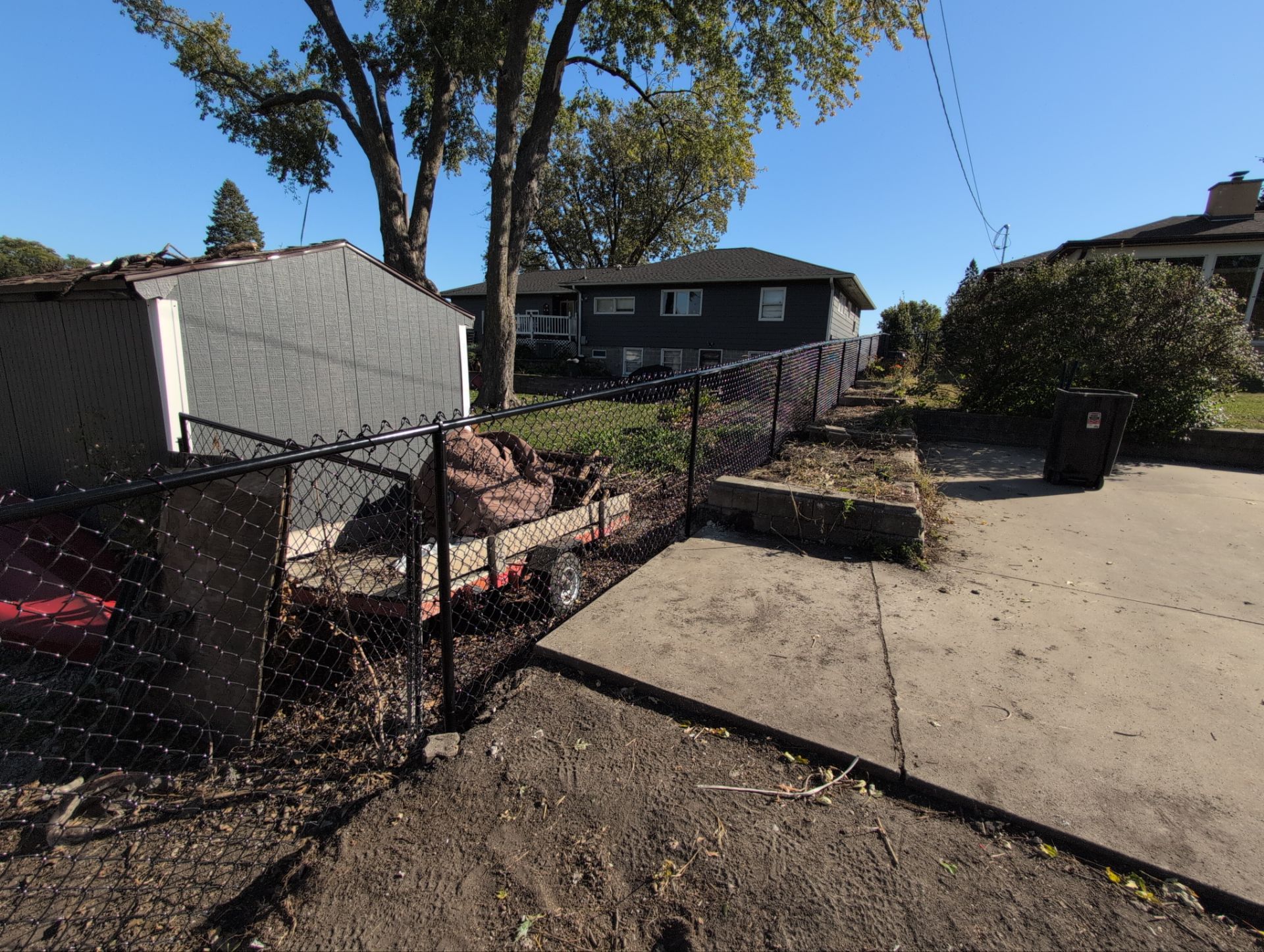 Black Chain Link Fence Installation for Waterloo Residential Property by Perfect Picket Fence and Stain