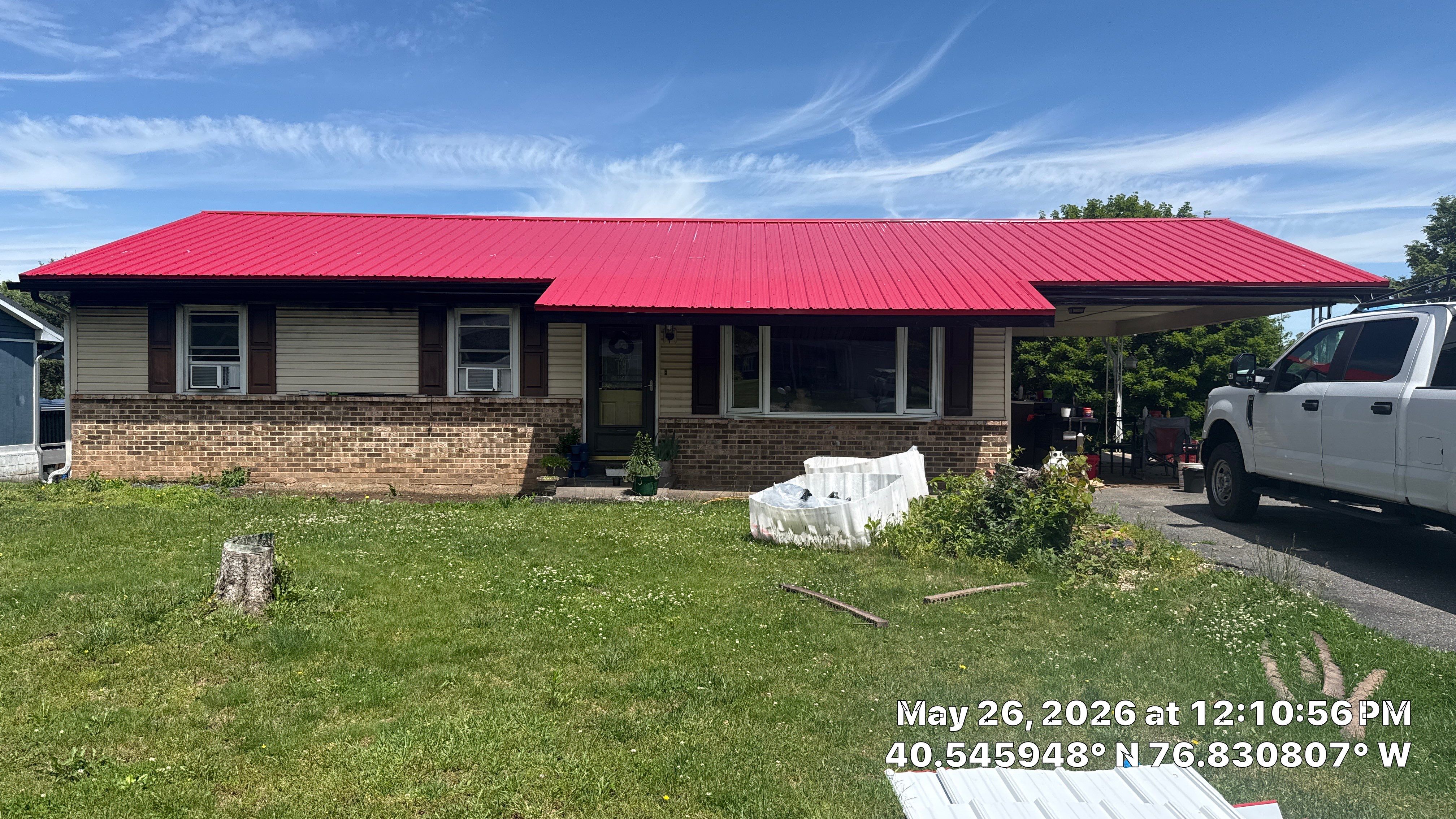 Red ABM Panel Metal Roofing Installation on Elizabethville Ranch Home by Esh Builders