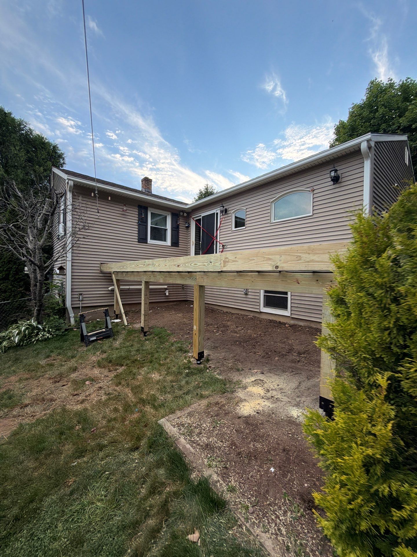 Deck Replacement using Trex Tropical Spiced Rum decking and Transcend White Railing by DiGiorgi Roofing and Siding Inc