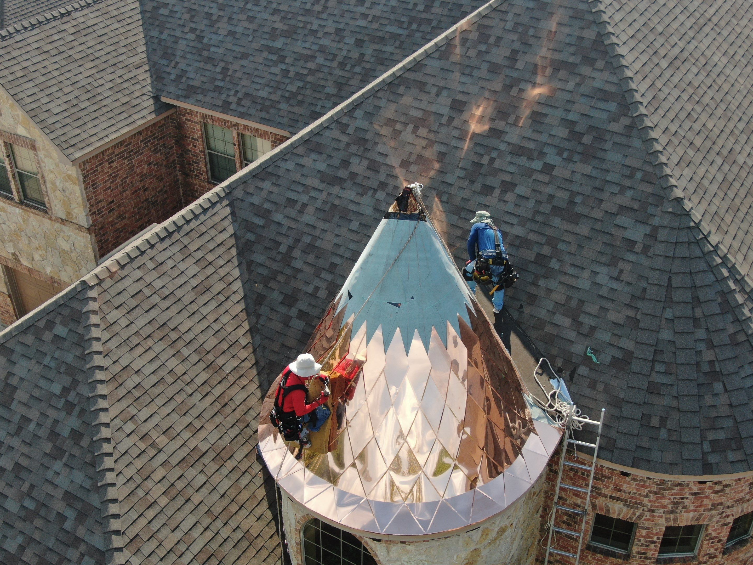 Installing Custom copper turret and Malarkey Vista Class 4 shingles Hail Damage Upgrade by Becker Roofing and Exteriors