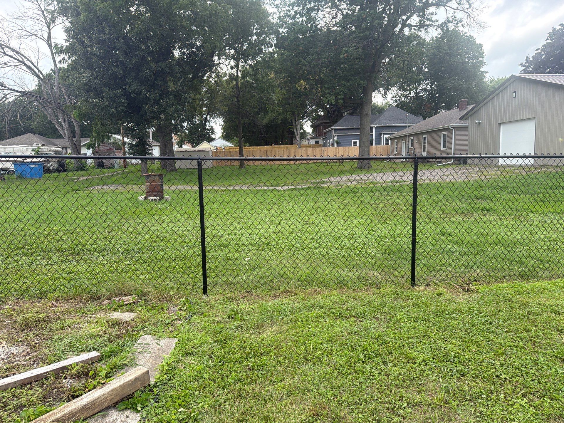Residential Black Chain Link Fence Installation in Reinbeck by Perfect Picket Fence and Stain