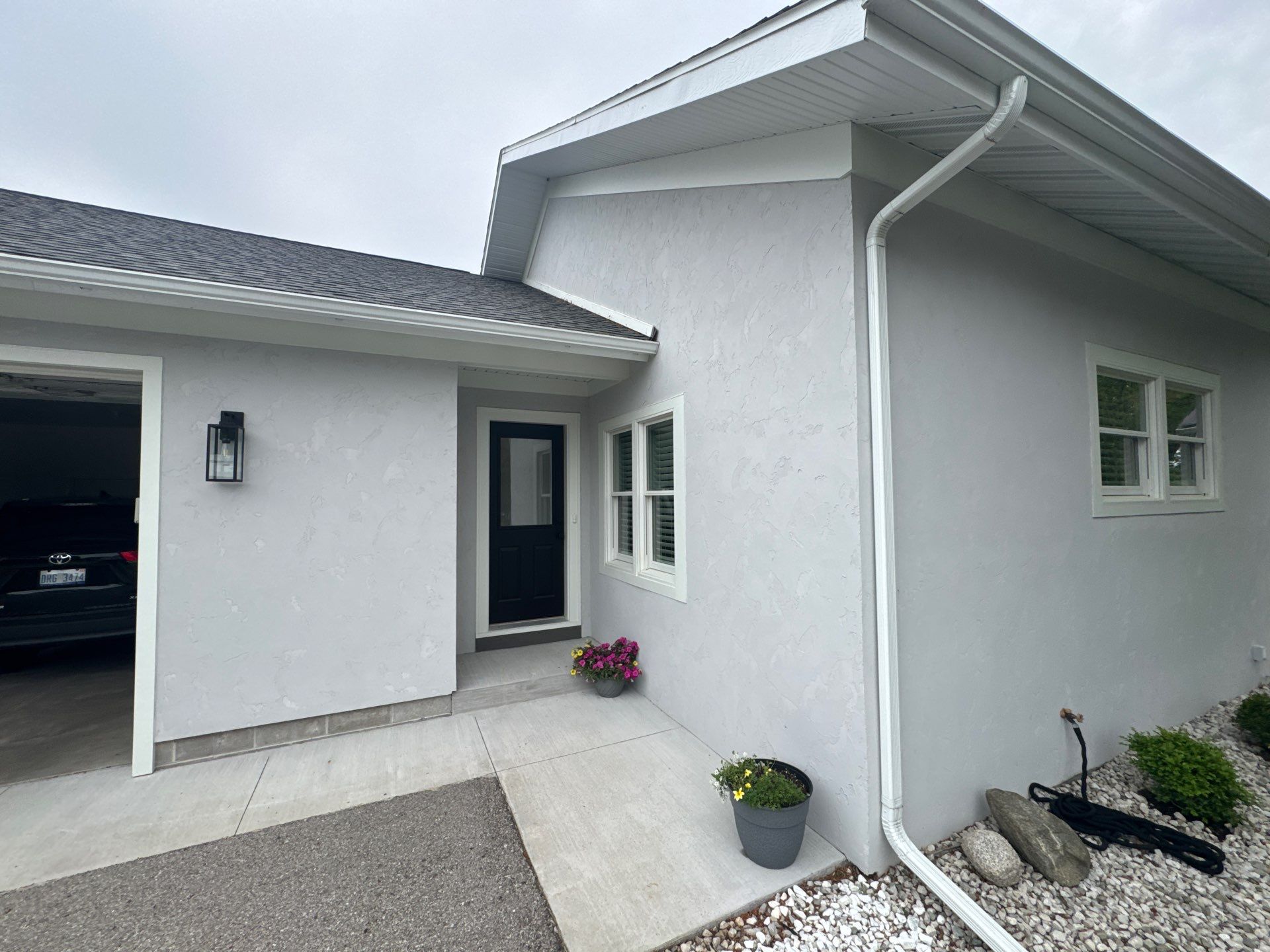 Norton Shores Residential Stucco Repair and Exterior Painting Refresh by Gordon Painting