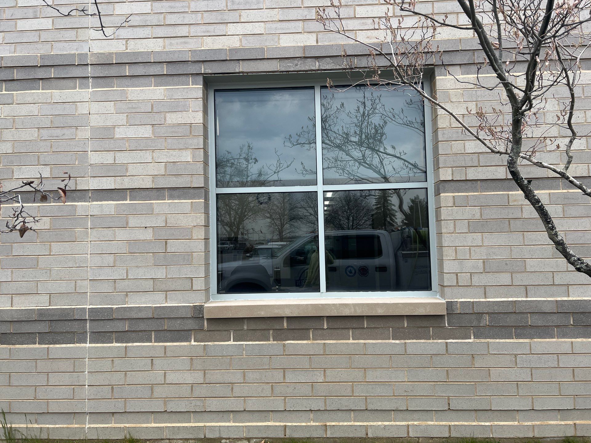 Commercial Facade cleaning using Algaecide, soft wash soap by Northern Power Washing LLC.