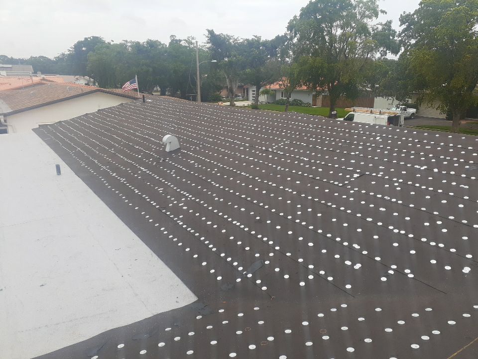 Residential Roofing Installation using 1" Nail strip metal roof by BLUES BROTHERS ROOFING