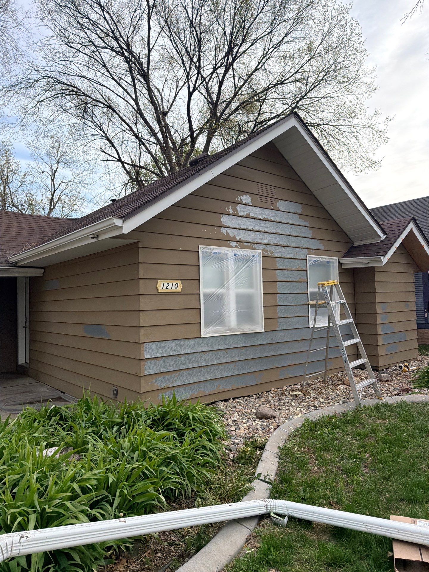 Exterior Siding Repair and Full House Repaint in Sioux Falls by Select Painting, Coatings & Garage Cabinets