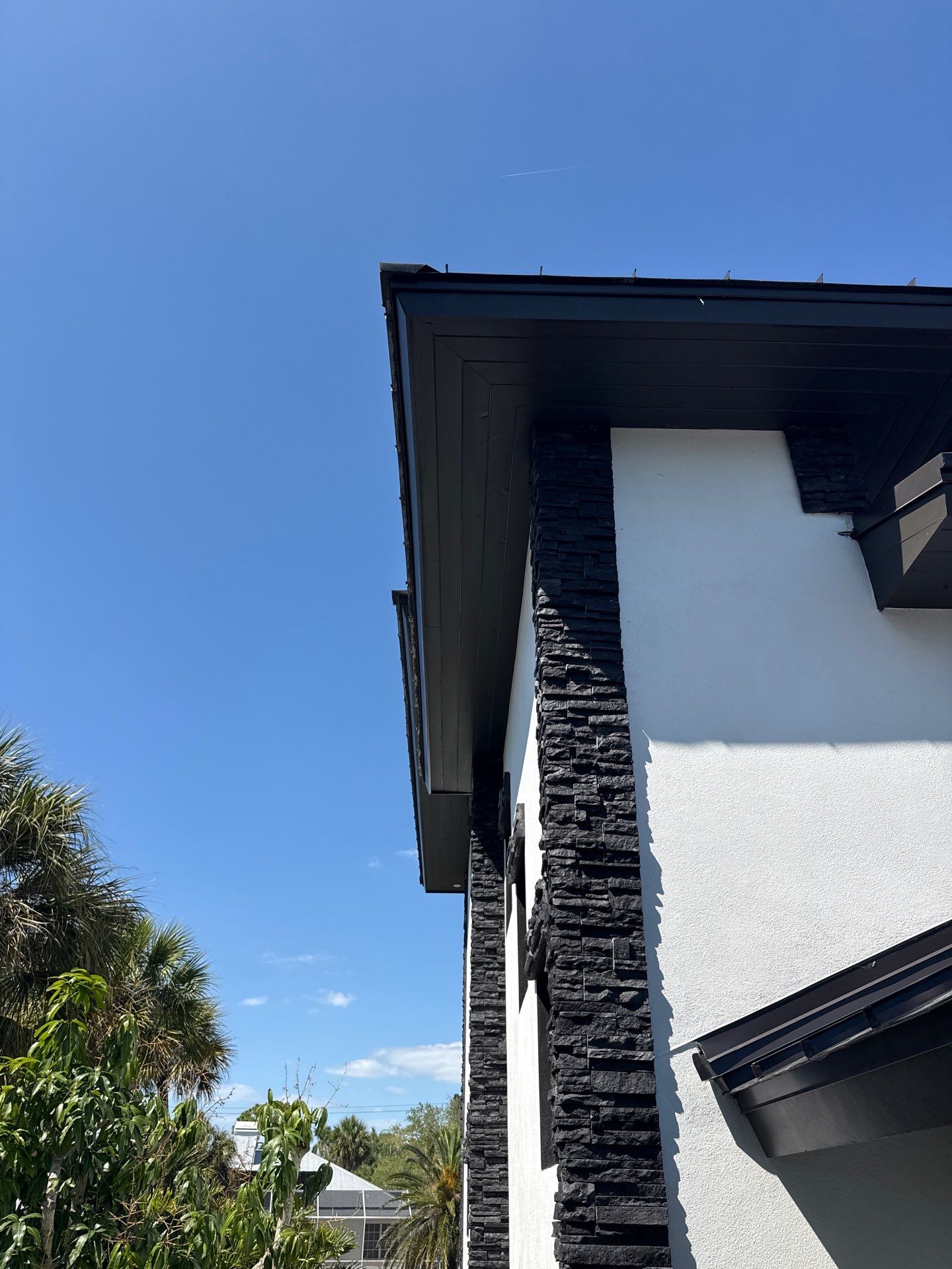 7-Inch Smooth Box Seamless Gutters using black seamless gutters in Siesta Key Fl by Gutter Professors