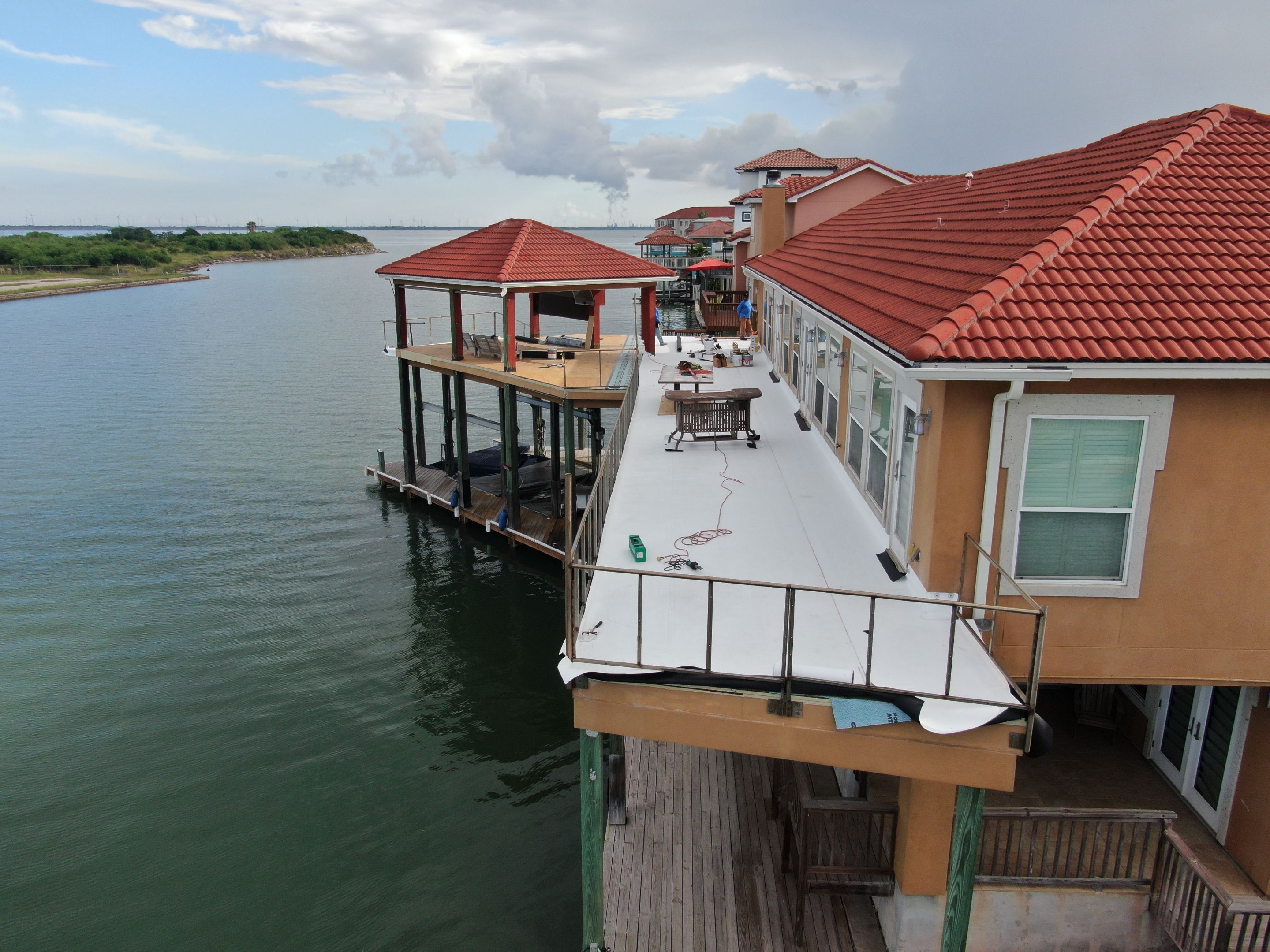 Walk Out Patio Cover by Bayfront Roofing and Construction