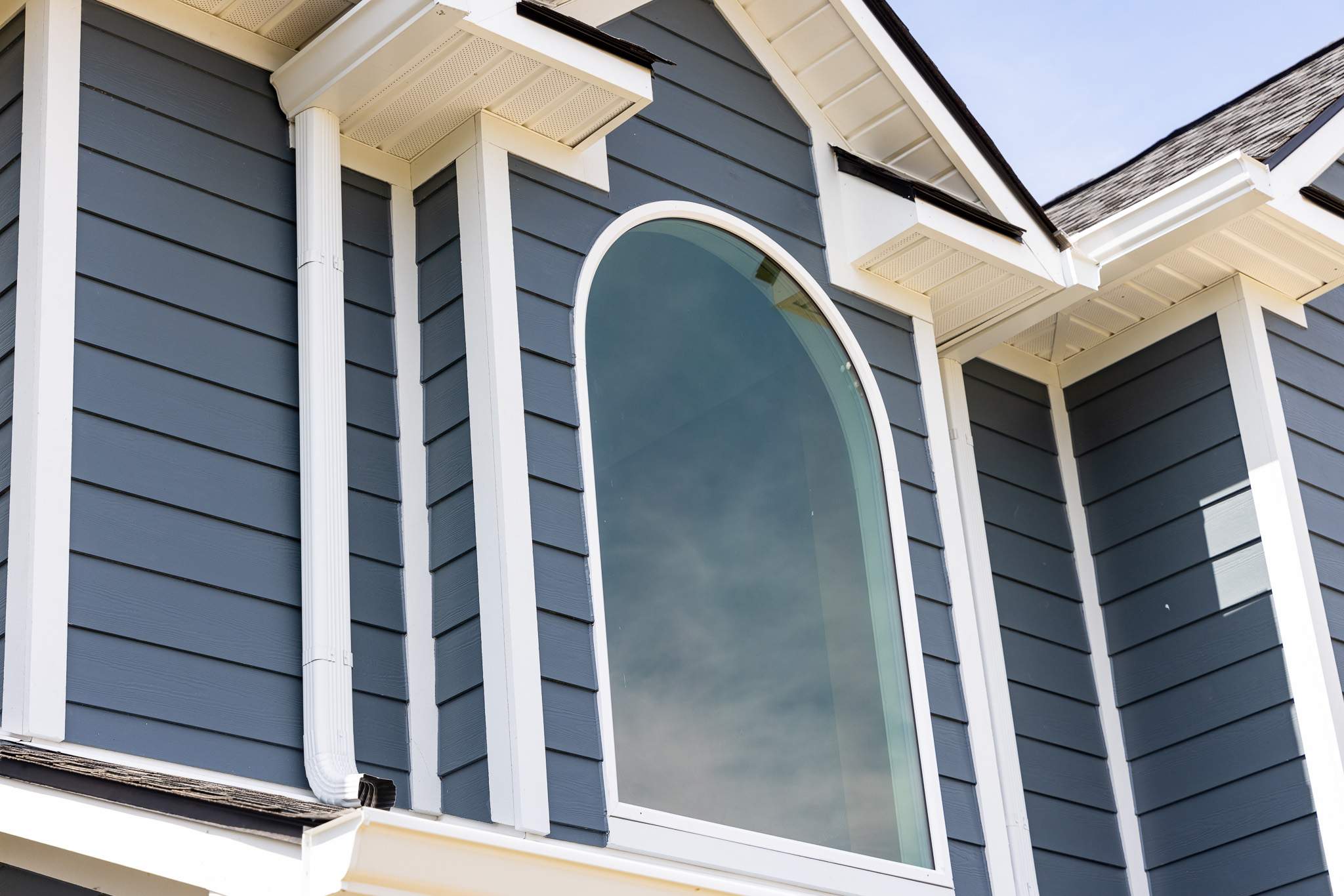 Evening Blue Hardie + Windows by Freedom Exteriors