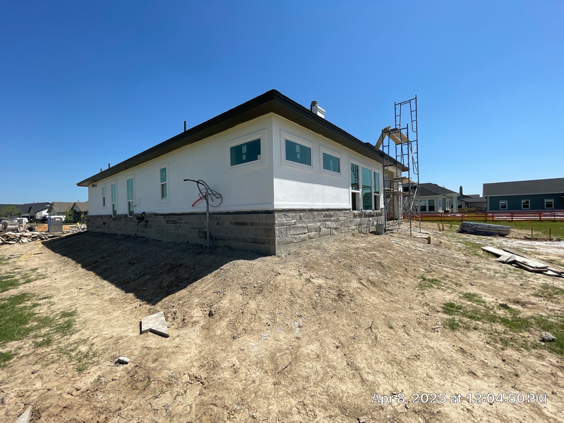 Waller Sophistication: Snowbound Color Stucco with Limestone Accents. by Apex Conventional Stucco Llc