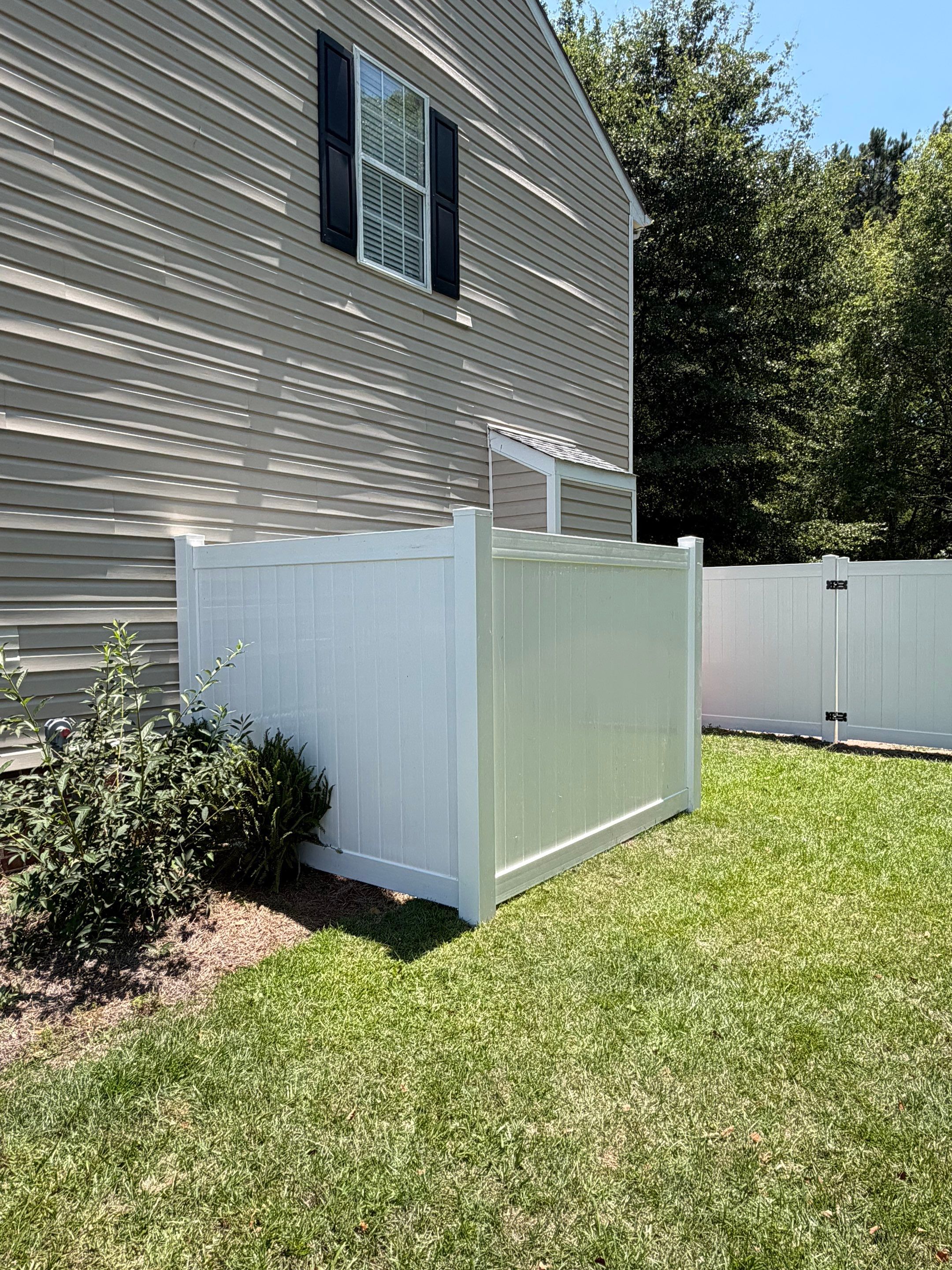 White Vinyl Privacy Fence Replacement with Double Gates in Greenville by Superior Fence and Rail