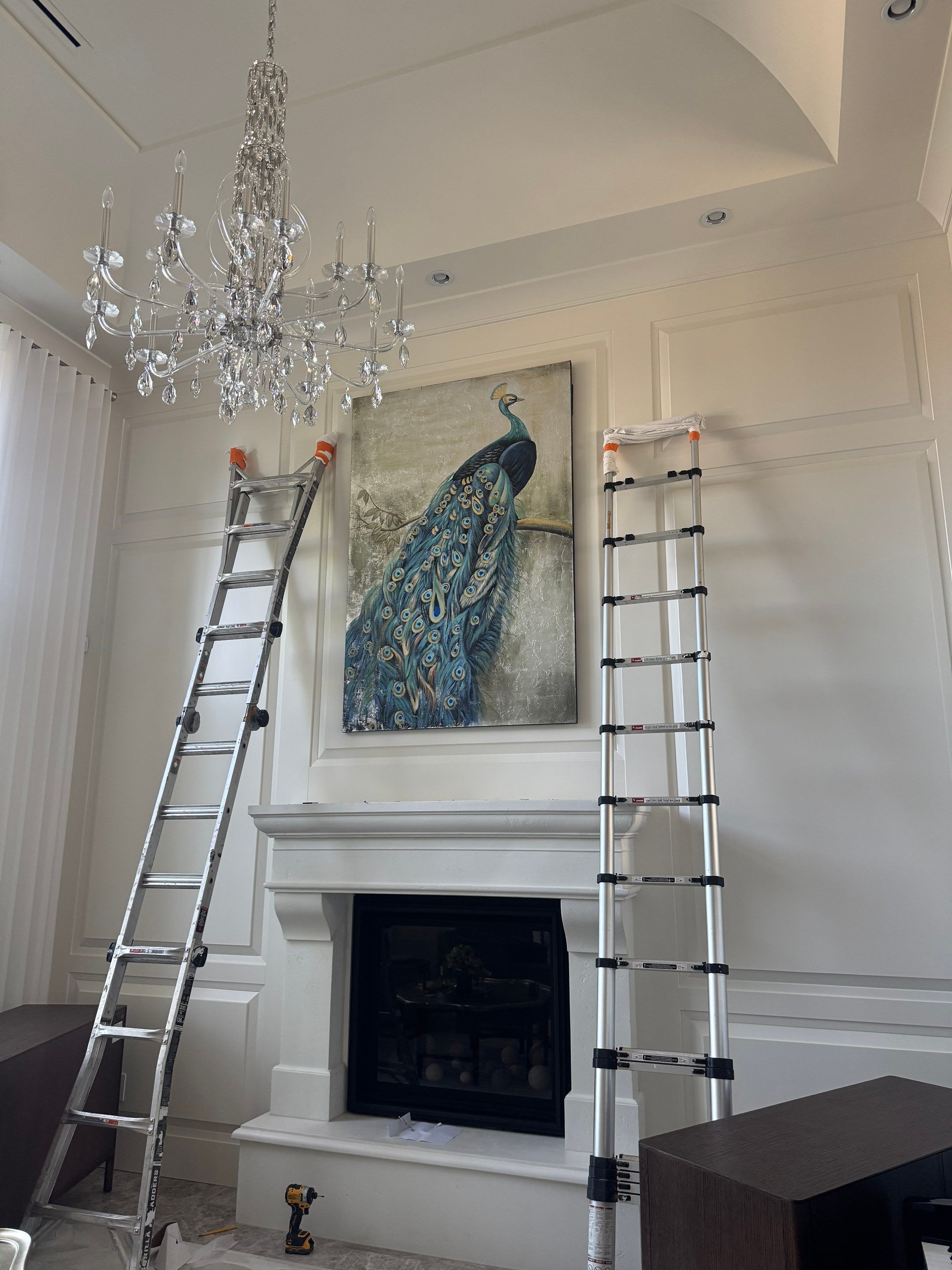 Professional Hanging of Mirrors & Art in a Designer Home by YVR Construction Group