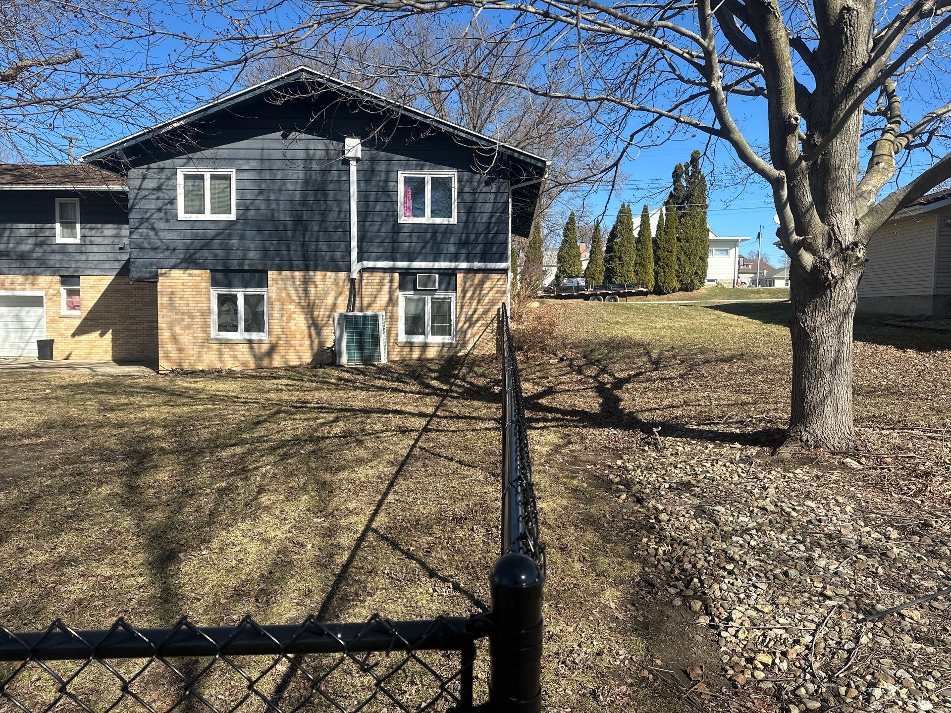 Black Chain Link Fence Installation with Double Gate in Grundy Center by Perfect Picket Fence and Stain