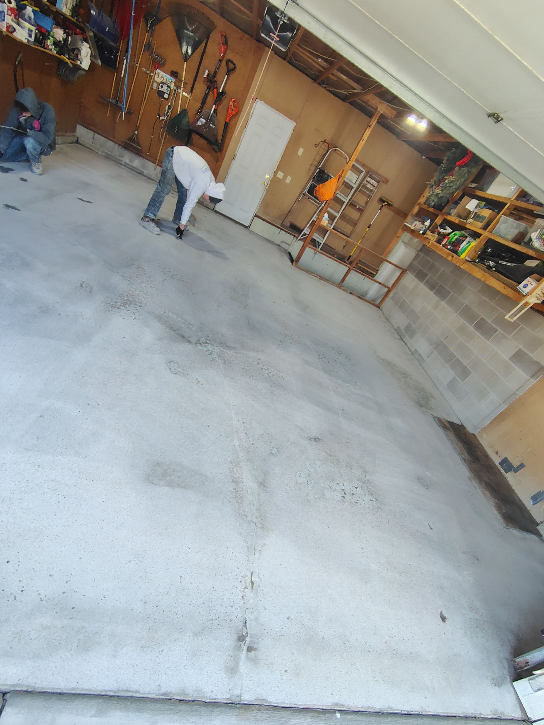 Sioux Falls Garage Epoxy Floor Installation and Concrete Crack Repair by Select Painting, Coatings & Garage Cabinets