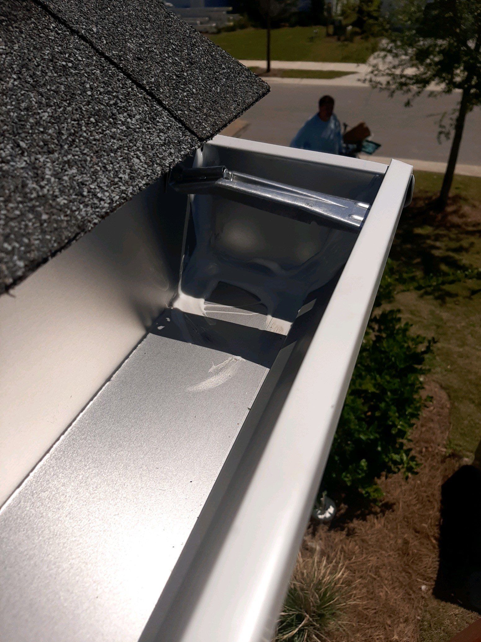 Gutter Installation Using White K-Style Aluminum Seamless Gutters by Gutter Professors