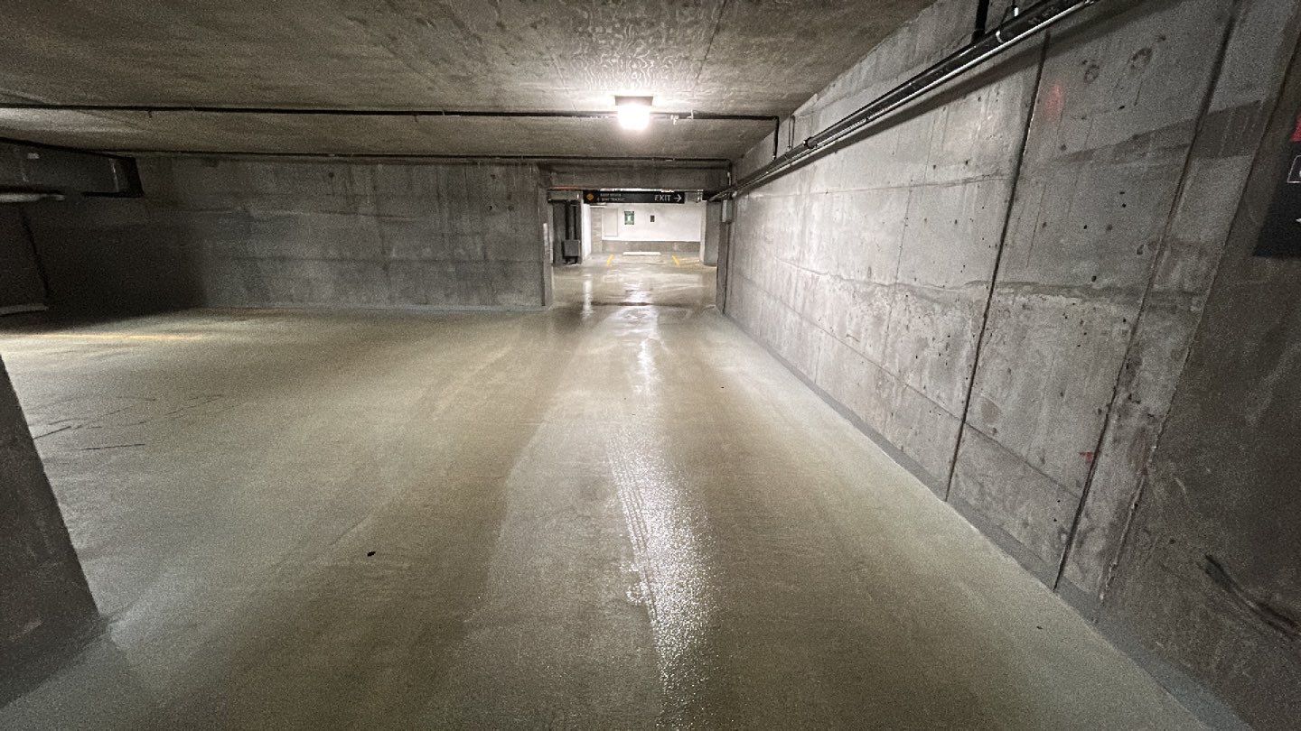 Parking garage using Hot water by Northern Power Washing LLC.