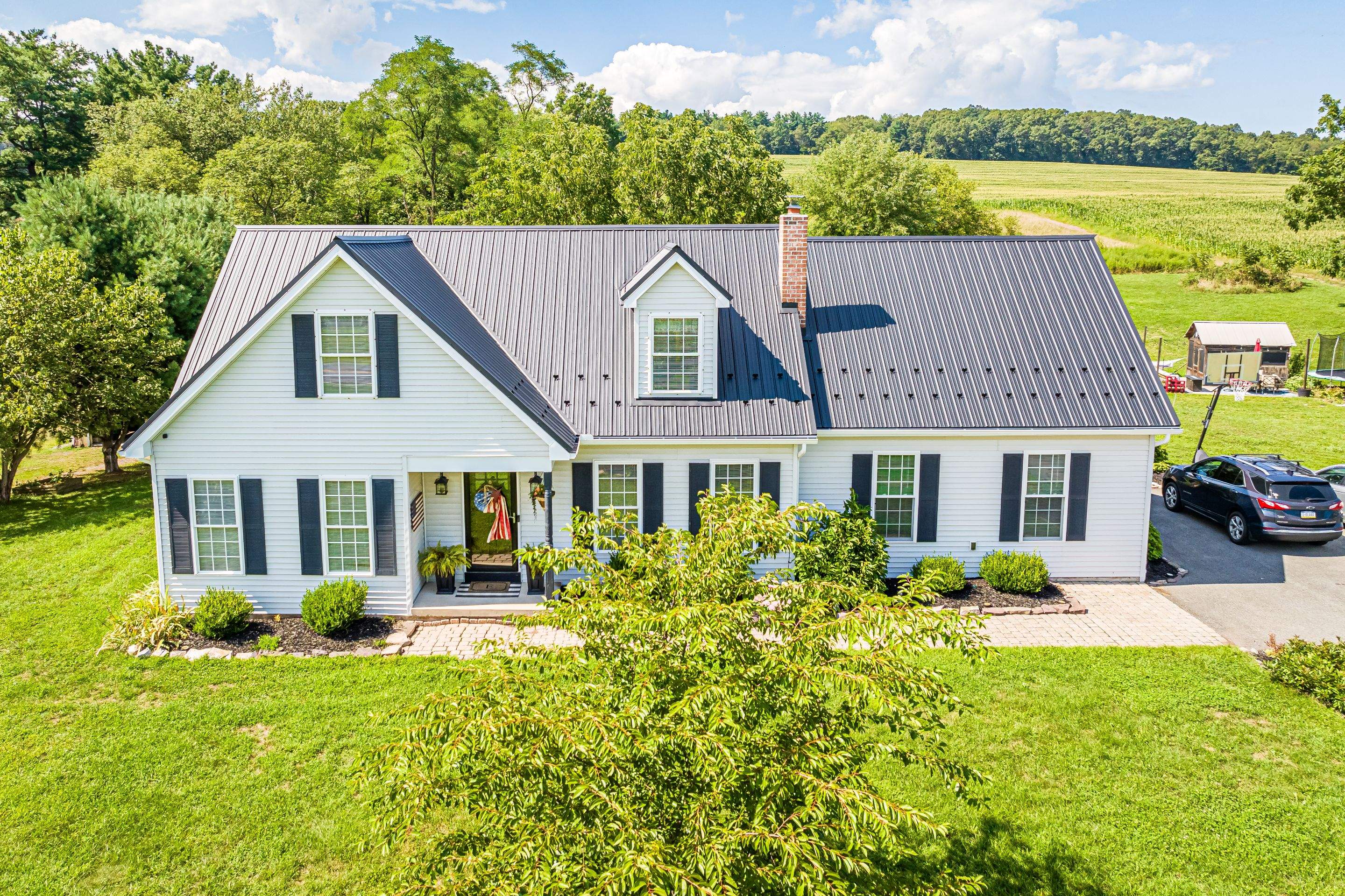 Metal roof install - black by Esh Builders