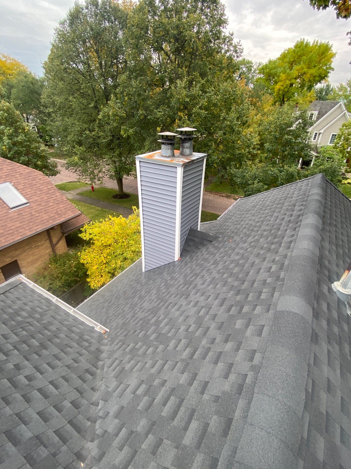 Asphalt Roof, Vinyl Siding, and Aluminum Gutter Replacement by Custom Installations