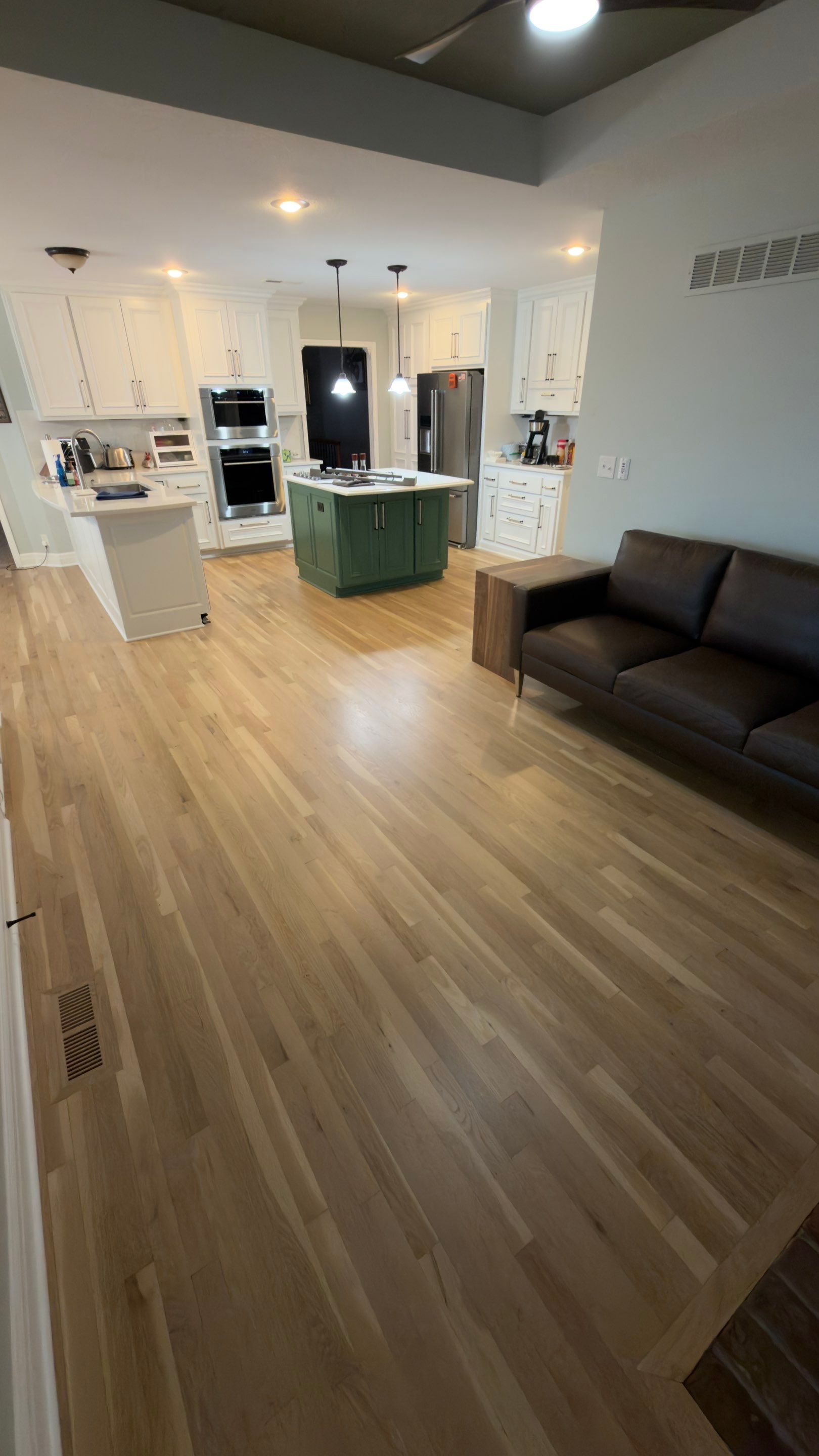 Hardwood Flooring Installation and Baseboard Trim in Grain Valley by Rippnfinish