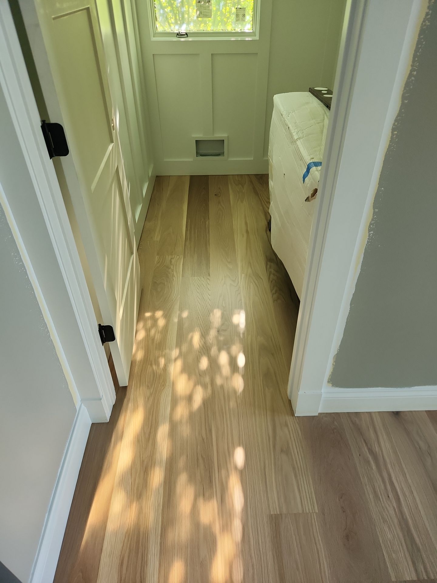  7 inch wide engineered  White Oak site sand and finish by Ann Arbor Hardwoods 