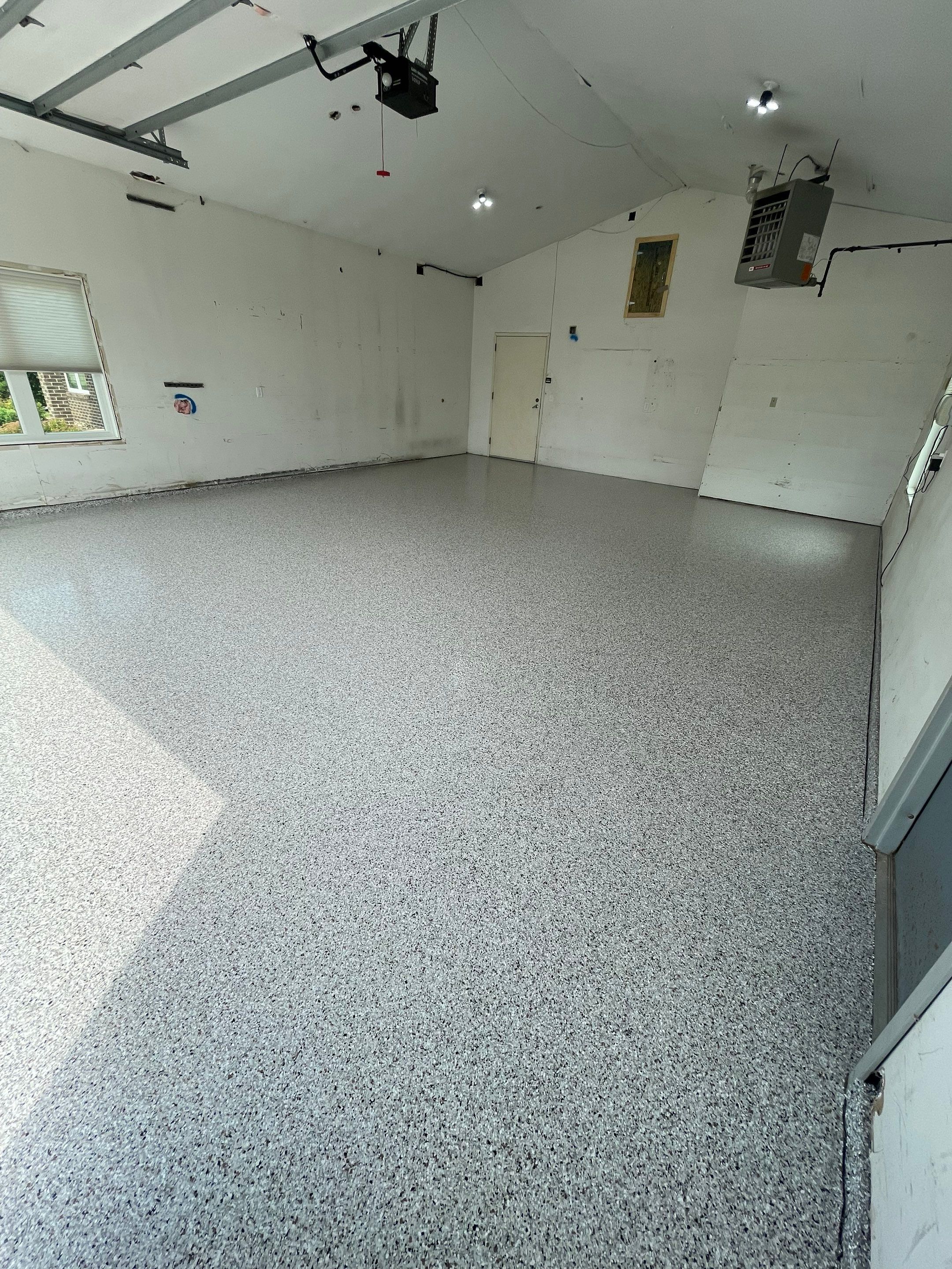 Coyote Flake Concrete Coating for Sioux Falls Garage by Select Painting, Coatings & Garage Cabinets