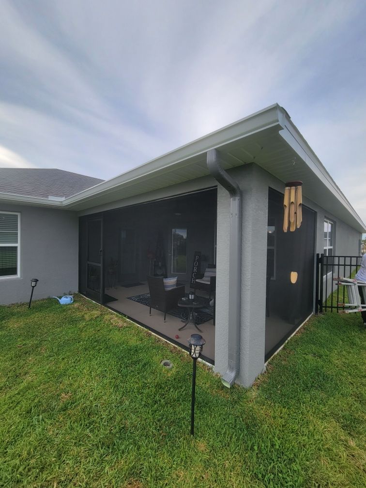 Grey Downspouts Installation in Parrish FL by Gutter Professors