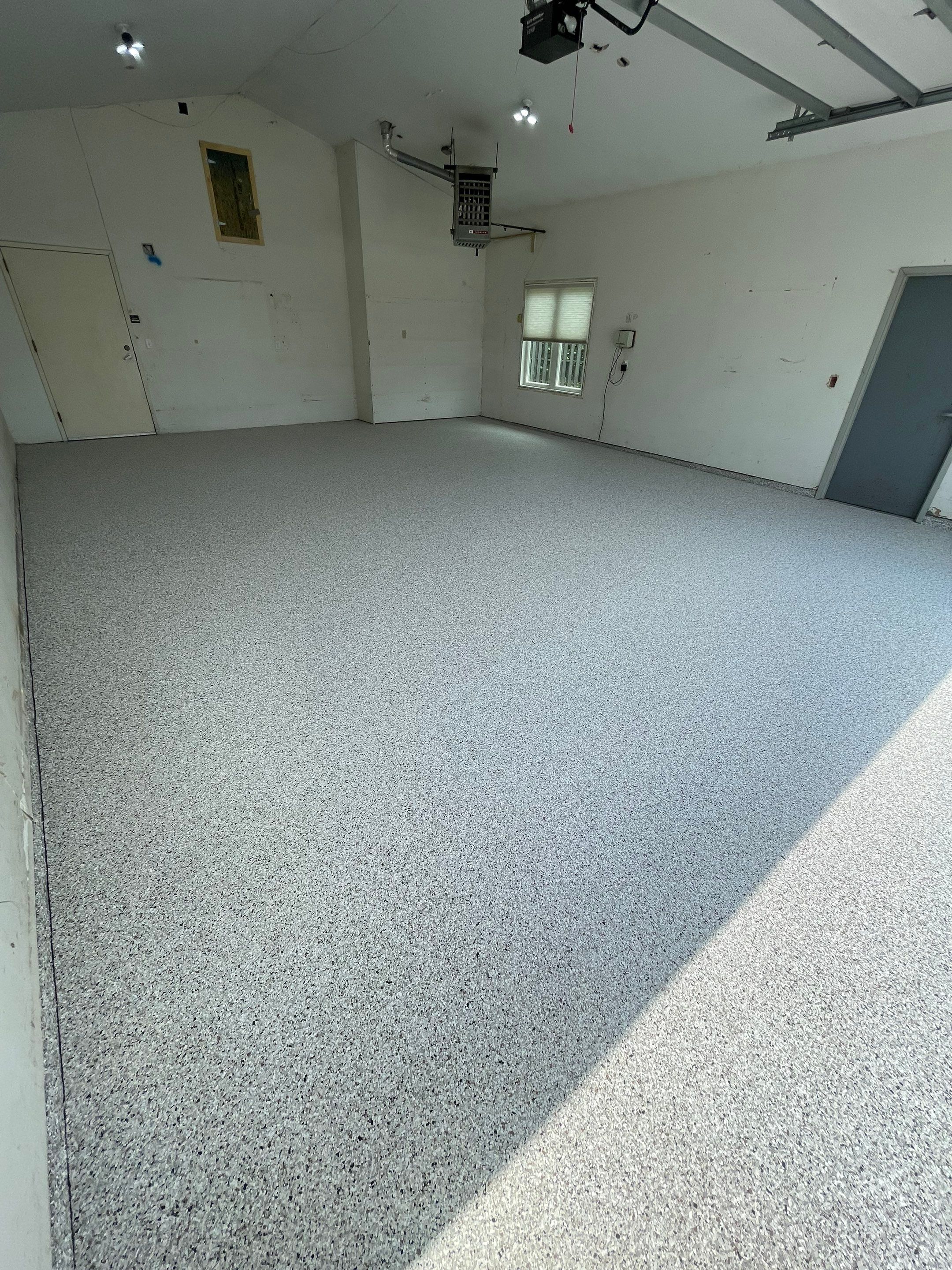 Coyote Flake Concrete Coating for Sioux Falls Garage by Select Painting, Coatings & Garage Cabinets