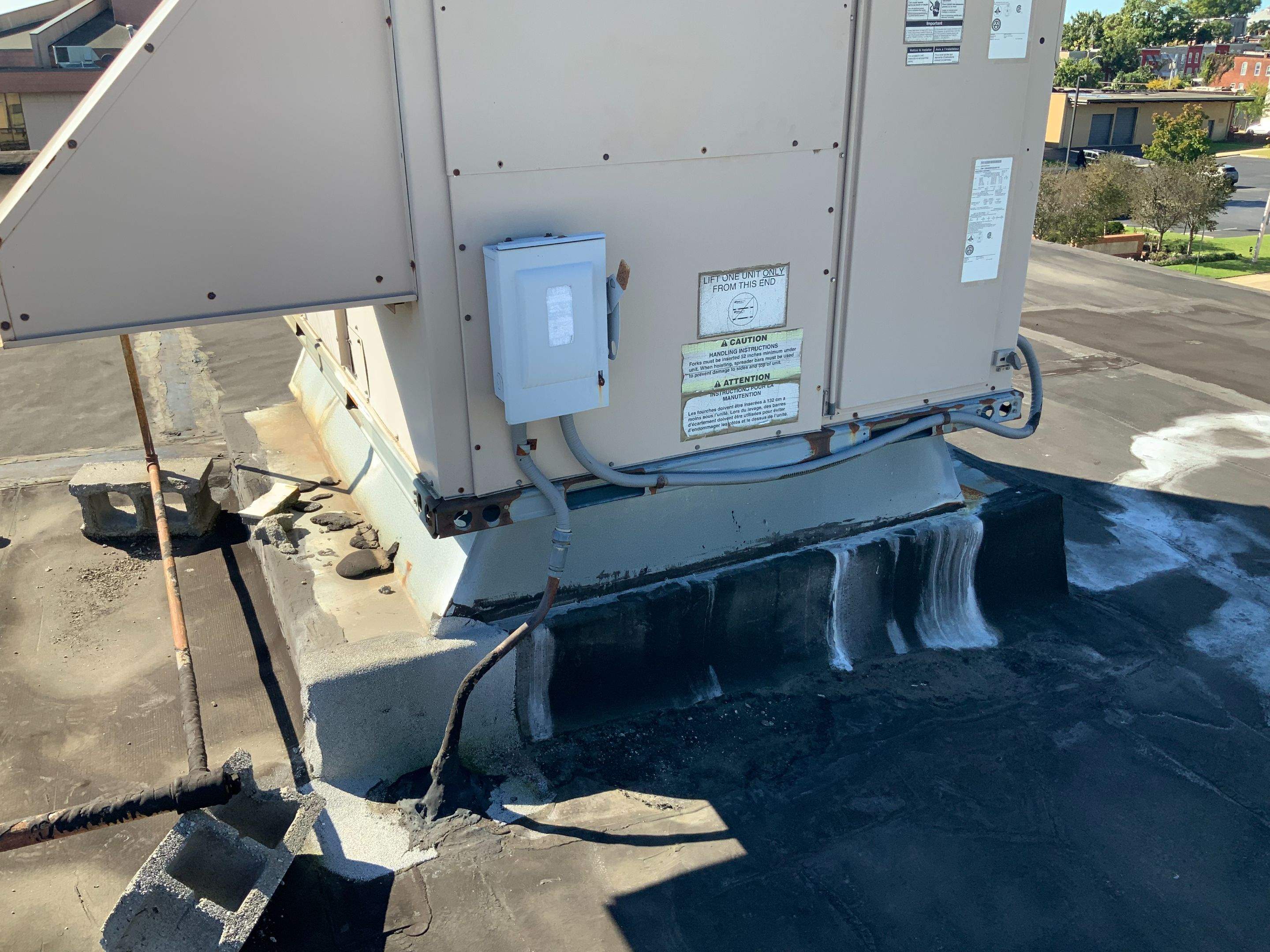 Commercial Roofing Repair using new Flashing by Alpha Design Services