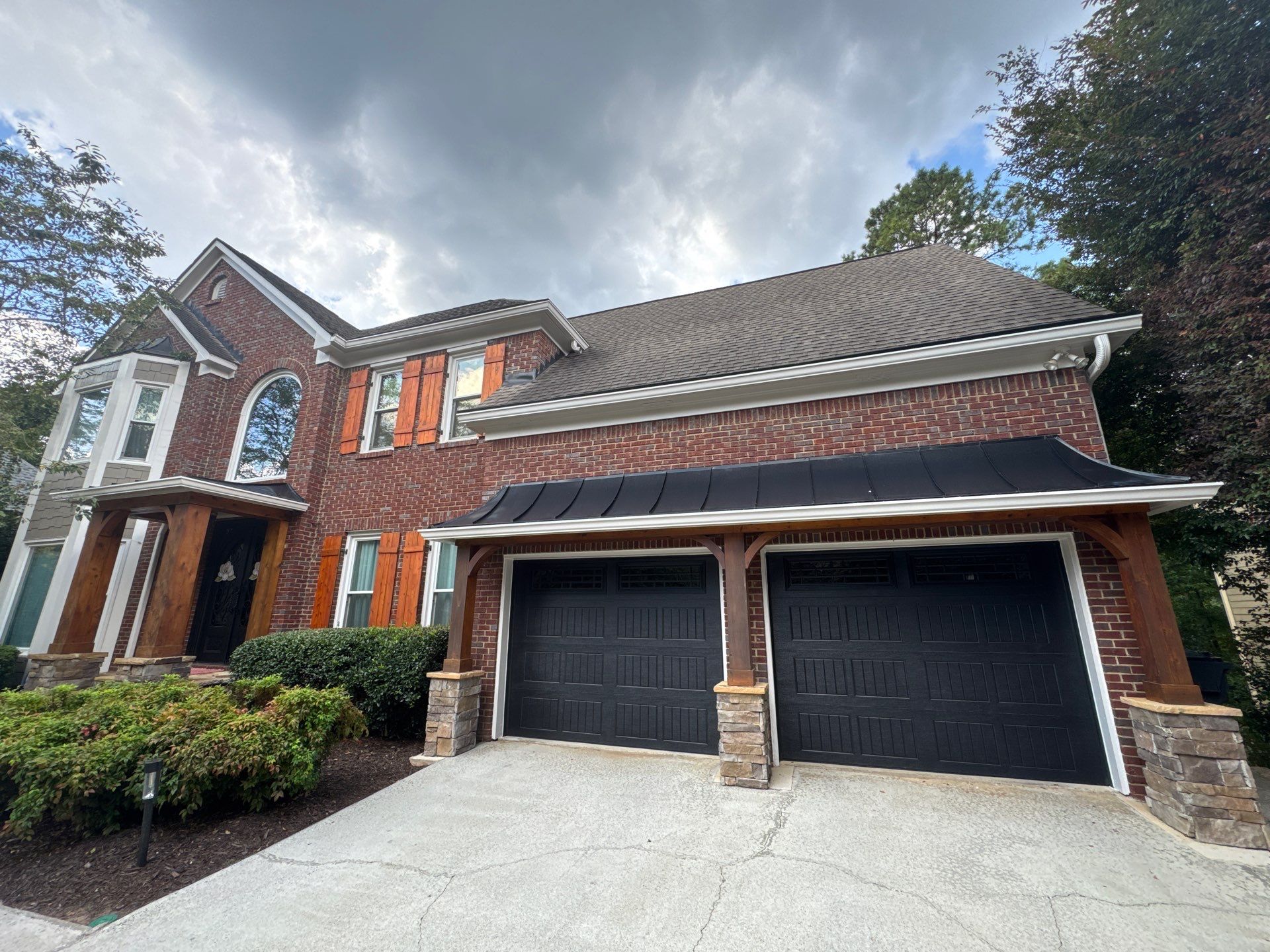 Exterior Modernization Featuring New Siding and Custom Wood Portico by Swift Home Renovations