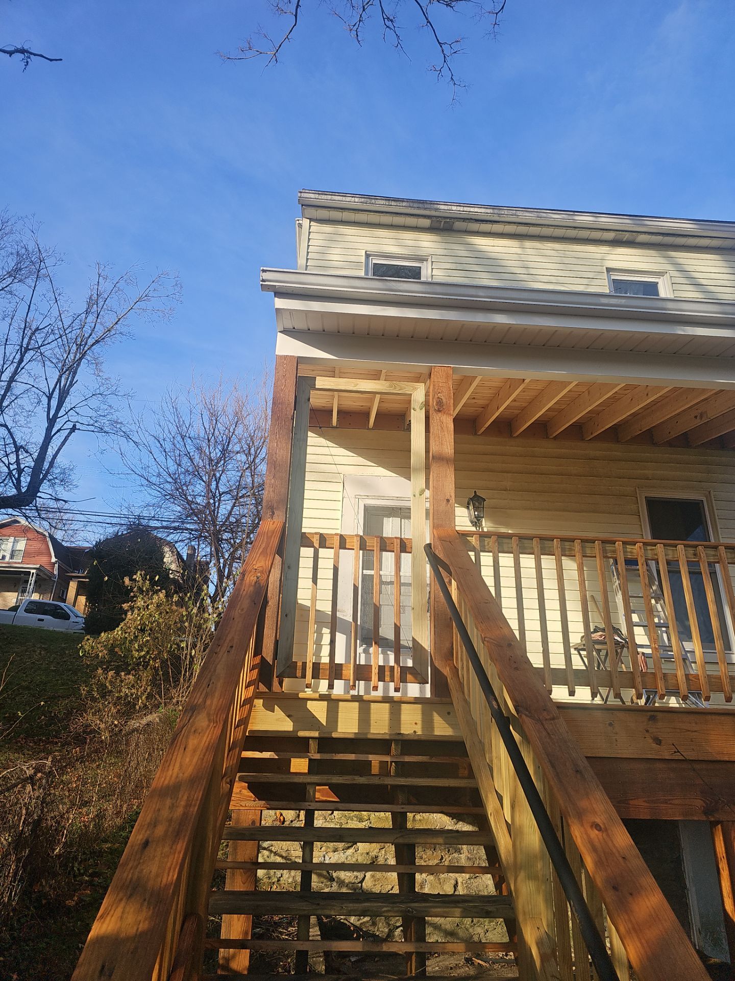 Deck and shed roof by Cousins Roofing Siding & Decks
