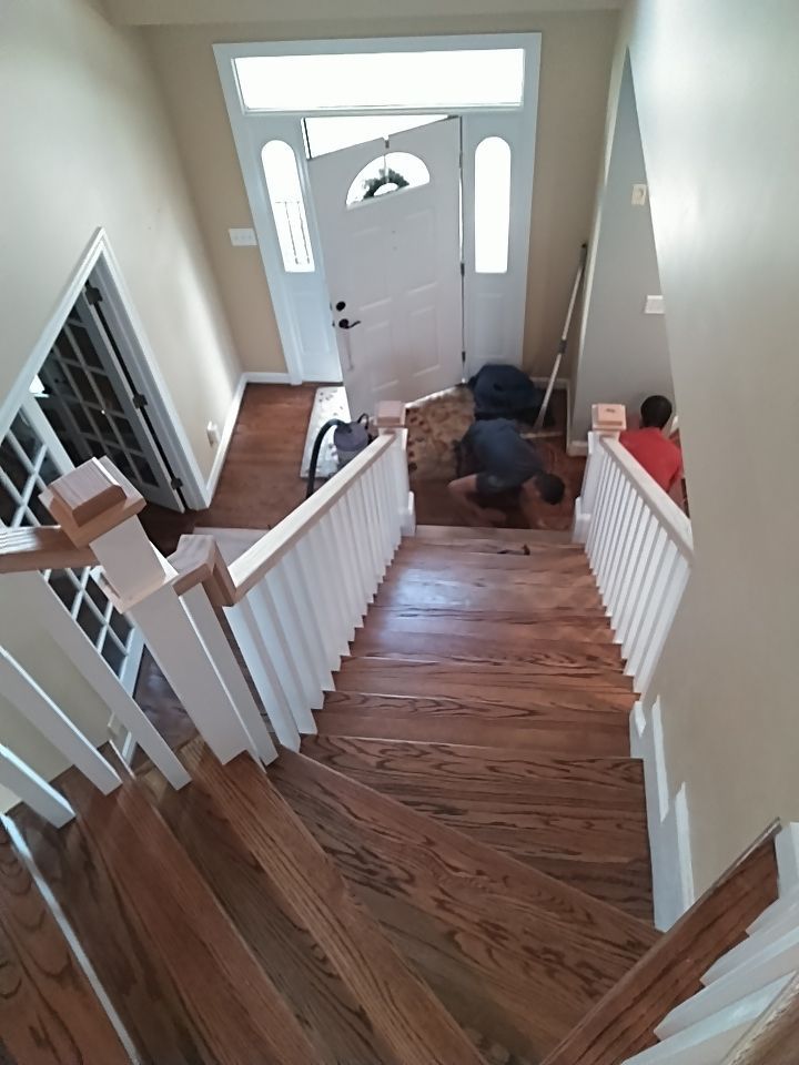 Stairway Installation using Red oak modern railings by House Custom Carpentry, LLC
