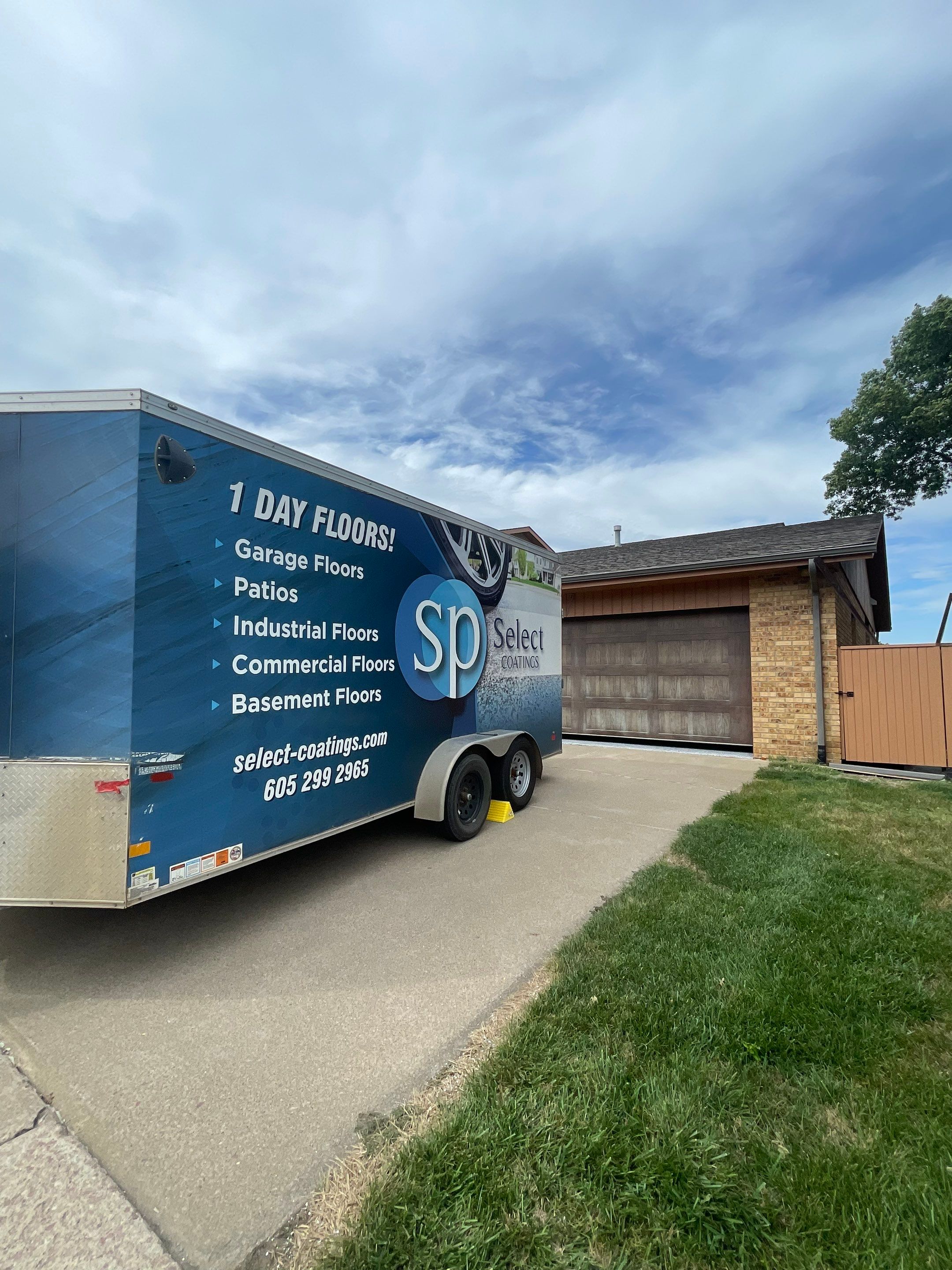 Grey Speckled Concrete Coating for Residential Garage in Yankton by Select Painting, Coatings & Garage Cabinets