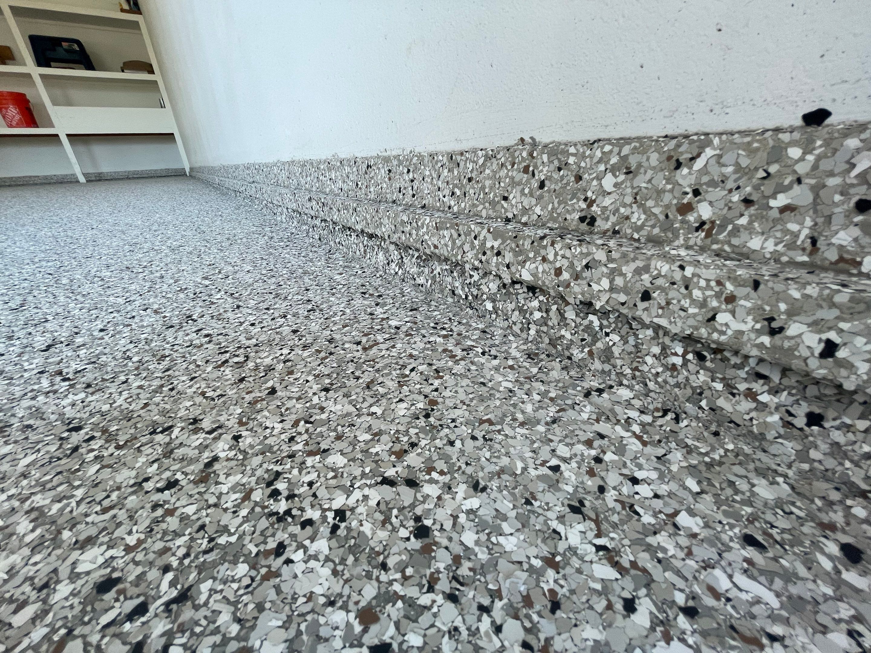 Yankton Garage Floor Restoration with Gray Speckled Epoxy Coating by Select Painting, Coatings & Garage Cabinets