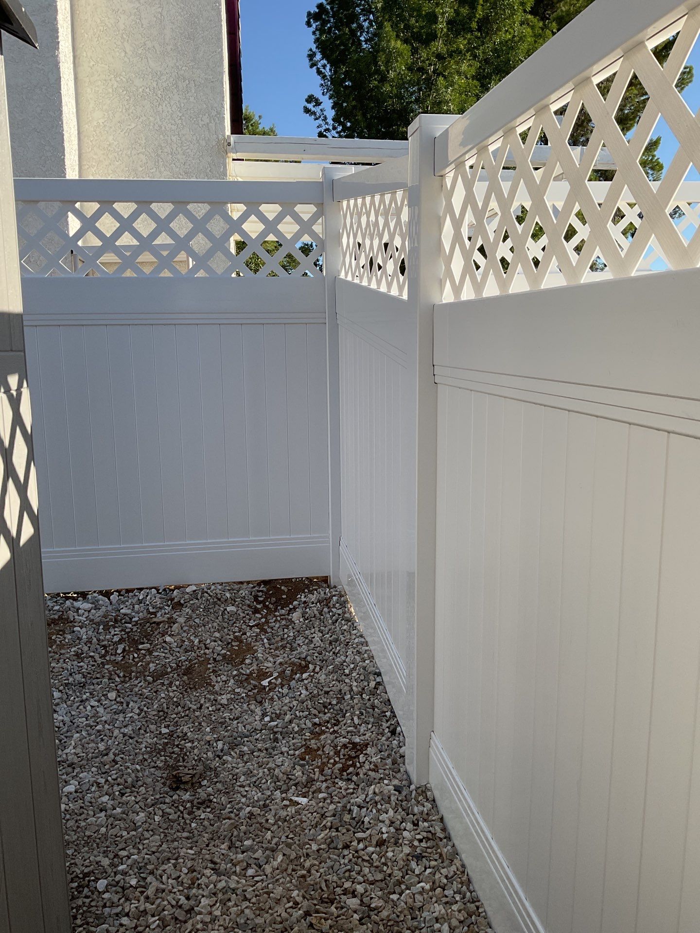Lattice Vinyl with Privacy Vinyl Fence by Fence Guys Inc.