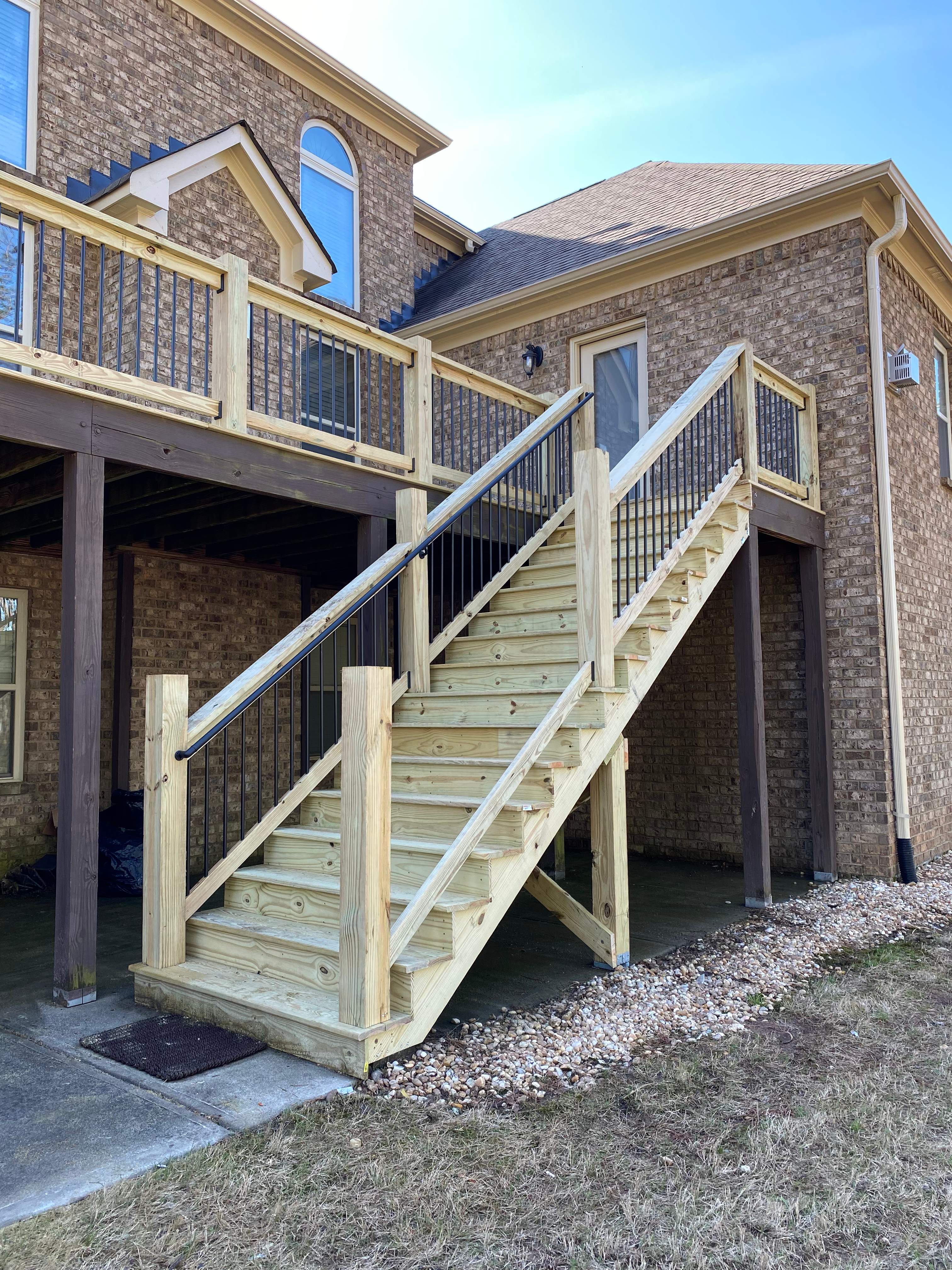 Elevated Pressure-Treated Wood Deck and Staircase in Hampton by Swift Home Renovations