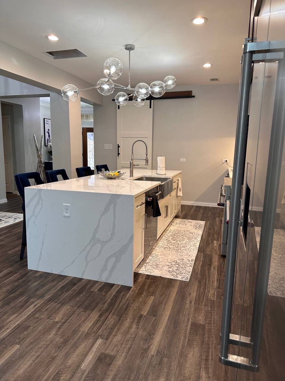 Kitchen Remodel using Calacata Quartz by Construction Nation Group