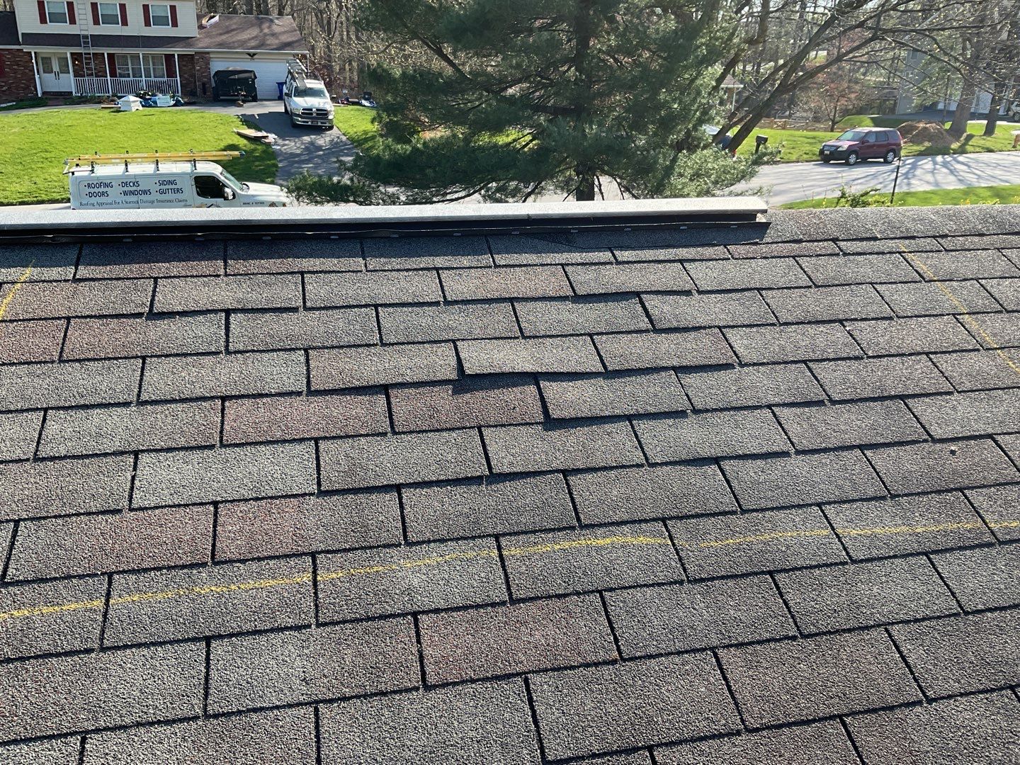 Residential Roofing Installation using Landmark Shingles Color Weatherwood by Alpha Design Services