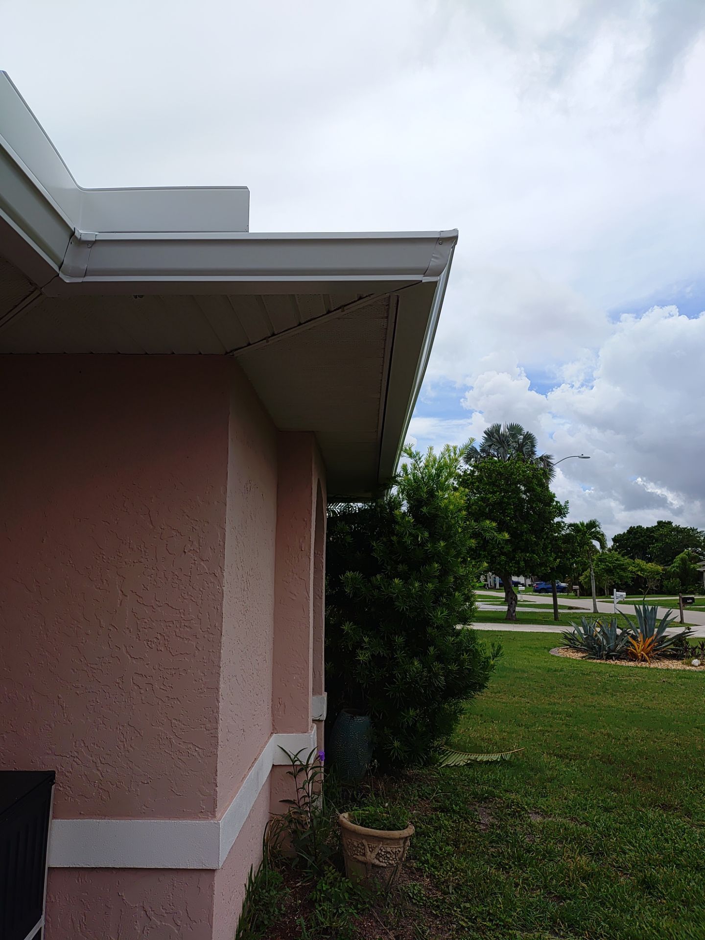 Replace gutter using White Down Spouts in Cape Coral FL by Gutter Professors