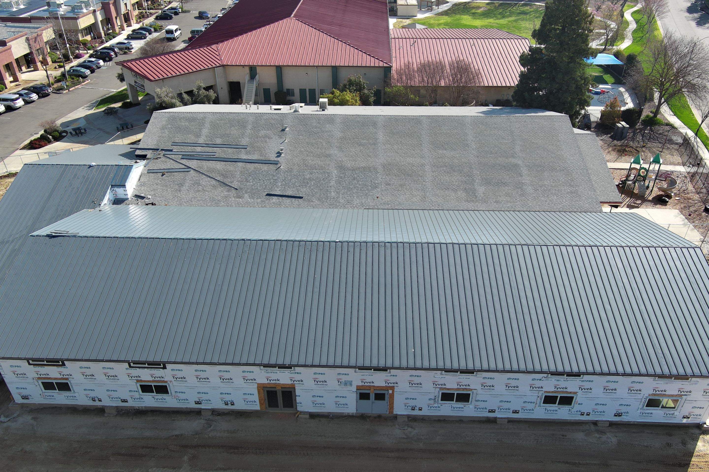 Metal roofing installation on church by Straight Edge Roofing Inc