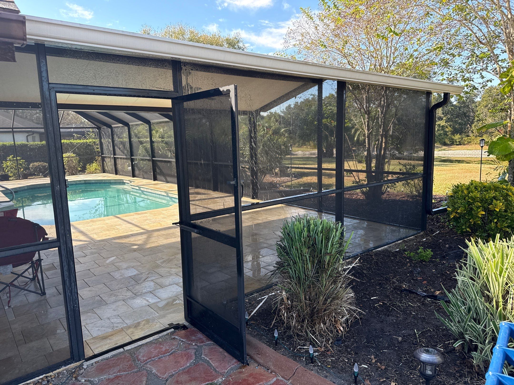 Paver Pool Deck & Screen Enclosure Cleaning | River Wilderness, Parrish FL by Sunshine AquaWash